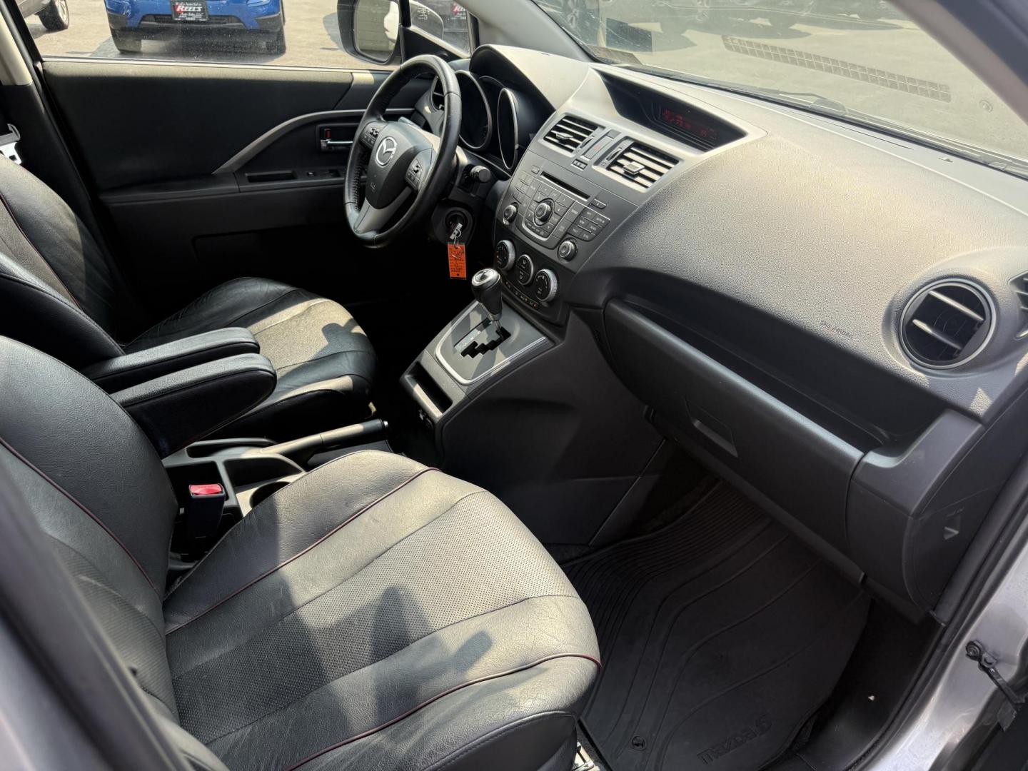 2015 Silver /Black Mazda MAZDA5 Grand Touring (JM1CW2DL0F0) with an 2.5L I4 DOHC 16V engine, 5-Speed Automatic transmission, located at 11115 Chardon Rd. , Chardon, OH, 44024, (440) 214-9705, 41.580246, -81.241943 - This 2015 Mazda Mazda 5 with a 2.5L I4 engine and 5-speed automatic transmission offers a versatile and comfortable minivan, achieving approximately 29 MPG highway. It features a leather interior, second-row captain’s seats, heated front seats, automatic climate control, a power moonroof, dusk-sen - Photo#36