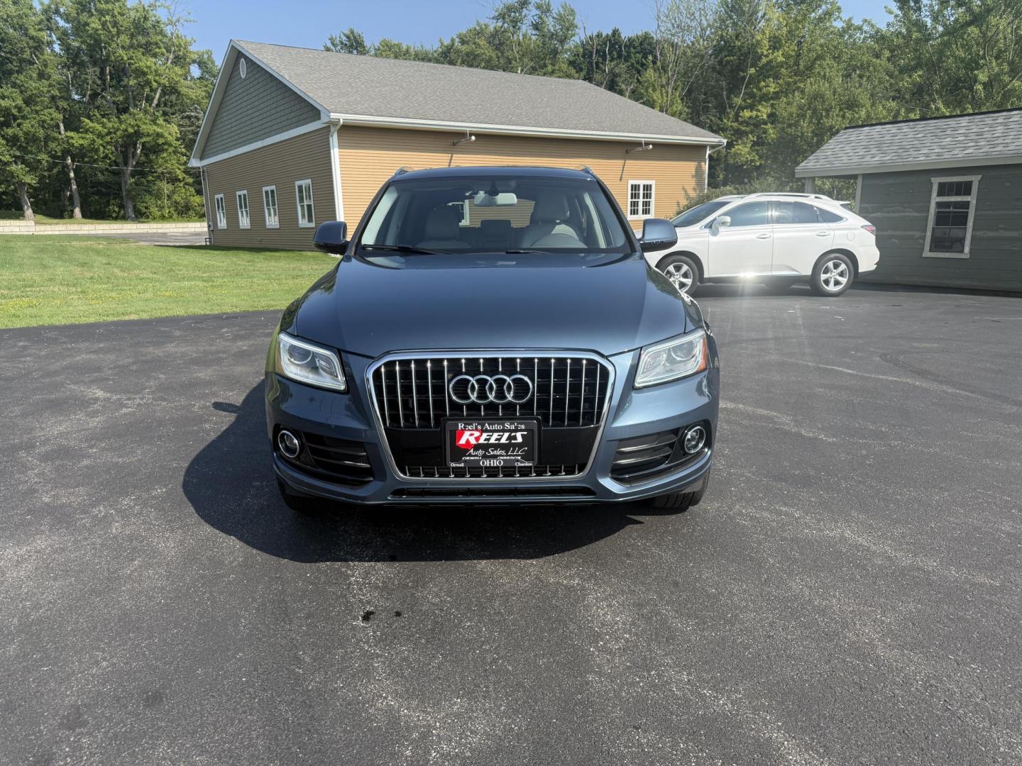 2017 Blue /Gray Audi Q5 2.0T Premium quattro (WA1C2AFP5HA) with an 2.0L I4 DOHC 16V Turbo engine, 8A transmission, located at 11115 Chardon Rd. , Chardon, OH, 44024, (440) 214-9705, 41.580246, -81.241943 - This 2017 Audi Q5 Premium features a 2.0L turbocharged I4 engine paired with an 8-speed automatic transmission and Audi’s renowned Quattro all-wheel drive, offering a blend of performance and efficiency with up to 27 MPG highway. Inside, it offers a refined leather interior, heated and power-adjus - Photo#1