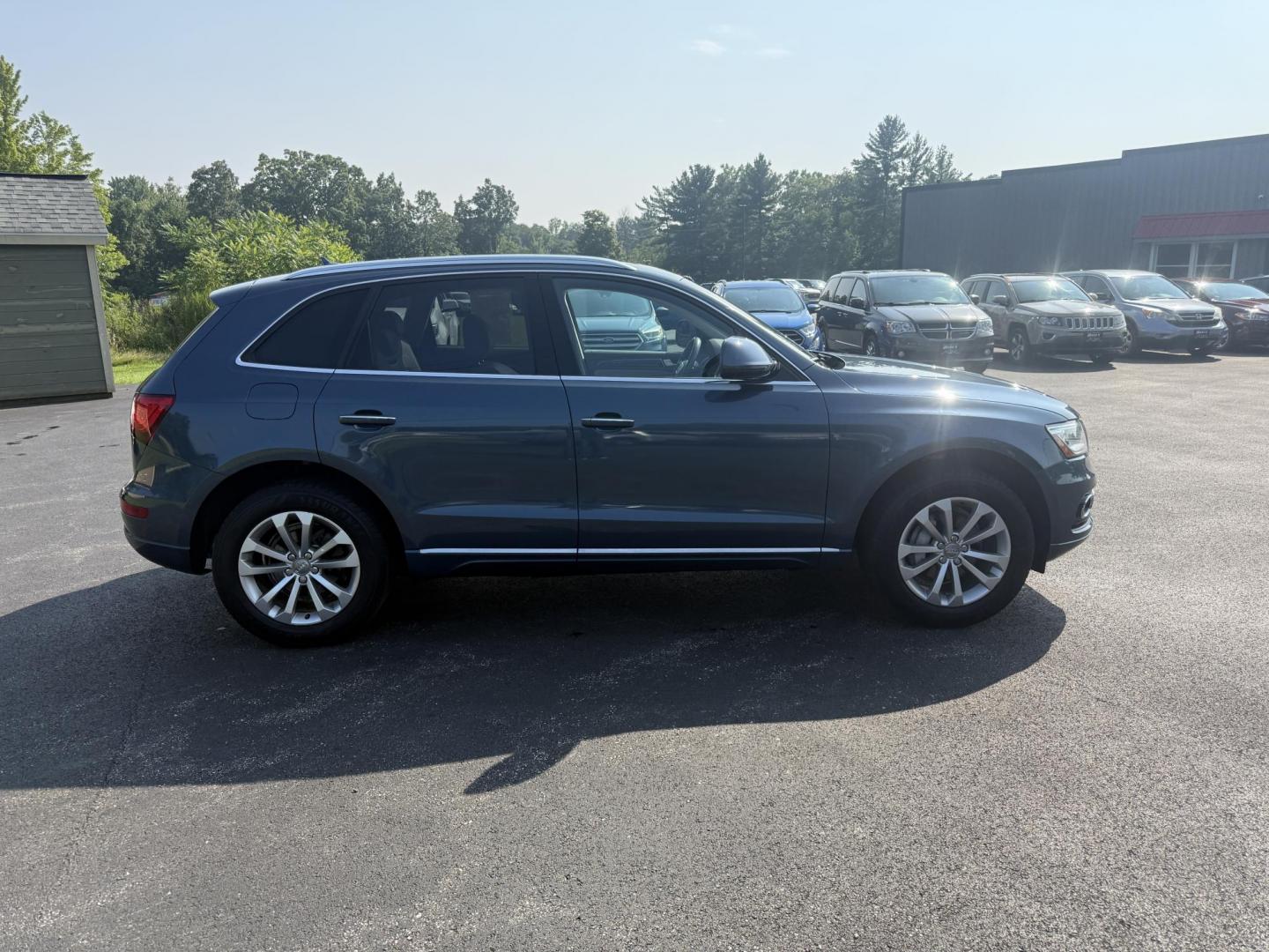 2017 Blue /Gray Audi Q5 2.0T Premium quattro (WA1C2AFP5HA) with an 2.0L I4 DOHC 16V Turbo engine, 8A transmission, located at 11115 Chardon Rd. , Chardon, OH, 44024, (440) 214-9705, 41.580246, -81.241943 - This 2017 Audi Q5 Premium features a 2.0L turbocharged I4 engine paired with an 8-speed automatic transmission and Audi’s renowned Quattro all-wheel drive, offering a blend of performance and efficiency with up to 27 MPG highway. Inside, it offers a refined leather interior, heated and power-adjus - Photo#5