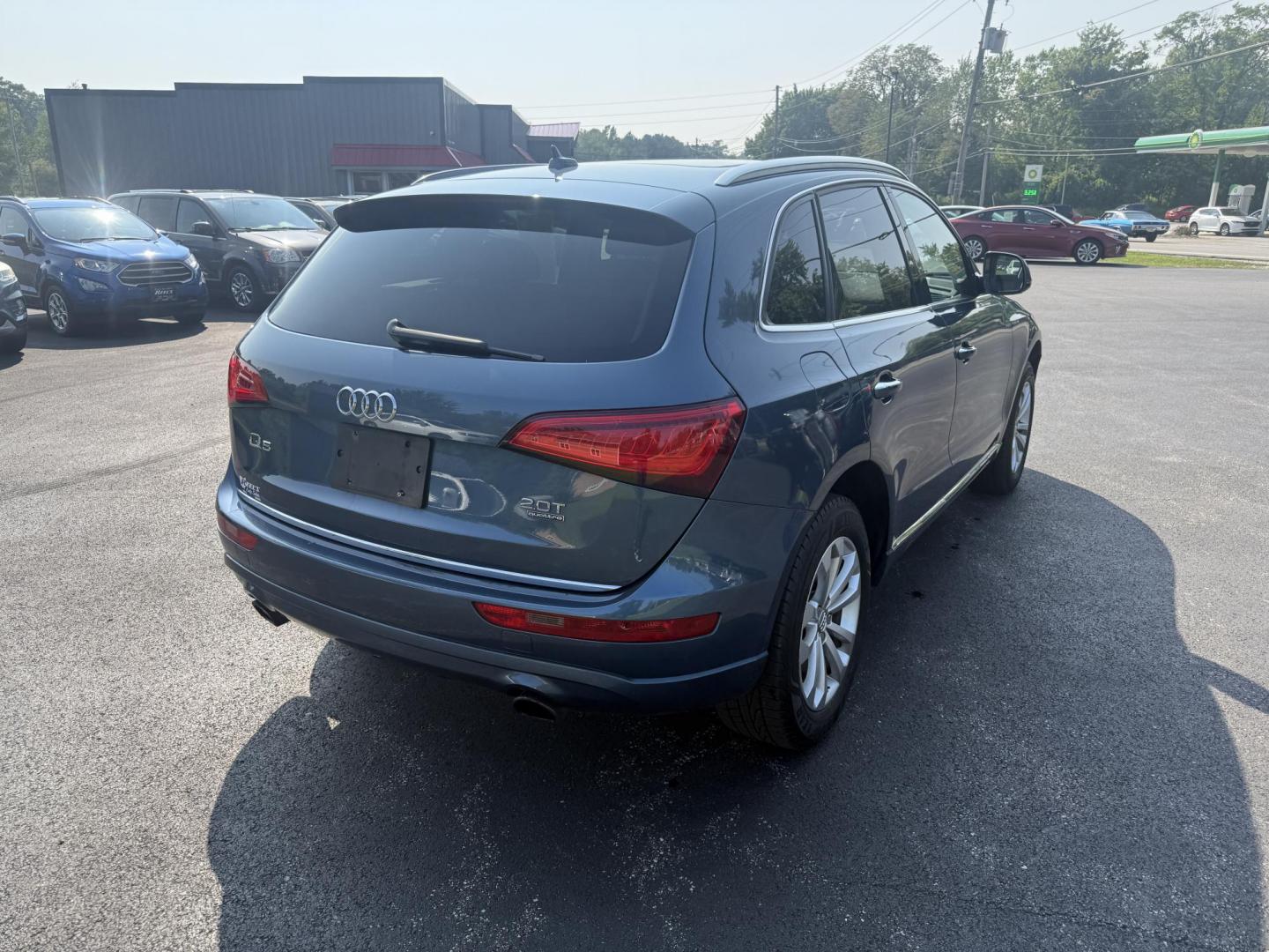 2017 Blue /Gray Audi Q5 2.0T Premium quattro (WA1C2AFP5HA) with an 2.0L I4 DOHC 16V Turbo engine, 8A transmission, located at 11115 Chardon Rd. , Chardon, OH, 44024, (440) 214-9705, 41.580246, -81.241943 - This 2017 Audi Q5 Premium features a 2.0L turbocharged I4 engine paired with an 8-speed automatic transmission and Audi’s renowned Quattro all-wheel drive, offering a blend of performance and efficiency with up to 27 MPG highway. Inside, it offers a refined leather interior, heated and power-adjus - Photo#7
