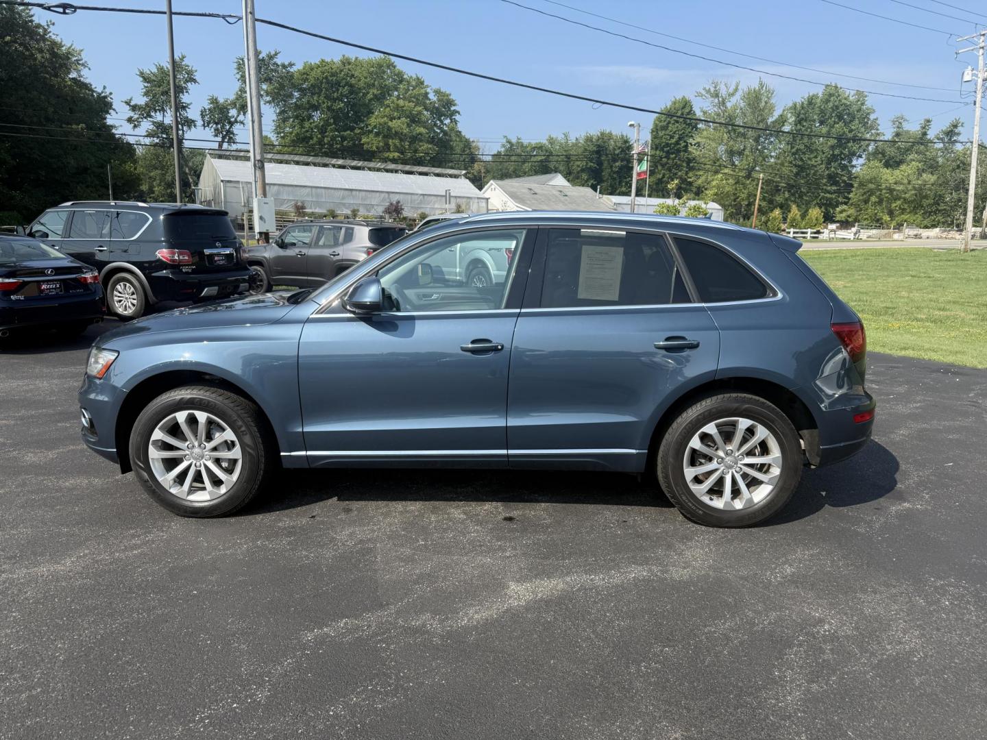 2017 Blue /Gray Audi Q5 2.0T Premium quattro (WA1C2AFP5HA) with an 2.0L I4 DOHC 16V Turbo engine, 8A transmission, located at 11115 Chardon Rd. , Chardon, OH, 44024, (440) 214-9705, 41.580246, -81.241943 - This 2017 Audi Q5 Premium features a 2.0L turbocharged I4 engine paired with an 8-speed automatic transmission and Audi’s renowned Quattro all-wheel drive, offering a blend of performance and efficiency with up to 27 MPG highway. Inside, it offers a refined leather interior, heated and power-adjus - Photo#12