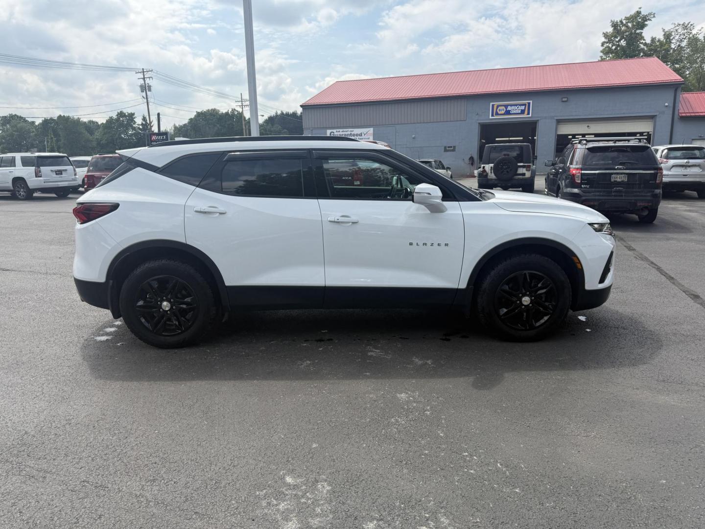 2021 White /Black Chevrolet Blazer 2LT AWD (3GNKBHRS1MS) with an 3.6L V6 DOHC 24V engine, 9A transmission, located at 547 E. Main St., Orwell, OH, 44076, (440) 437-5893, 41.535435, -80.847855 - This 2021 Chevrolet Blazer 2LT AWD is a sporty midsize SUV powered by a 3.6L V6 engine and 9-speed automatic transmission, delivering a robust 0-60 mph time of 6.1 seconds and a 4,500-pound towing capacity. It features a power driver’s seat, heated front seats, dual-zone automatic climate control, - Photo#5