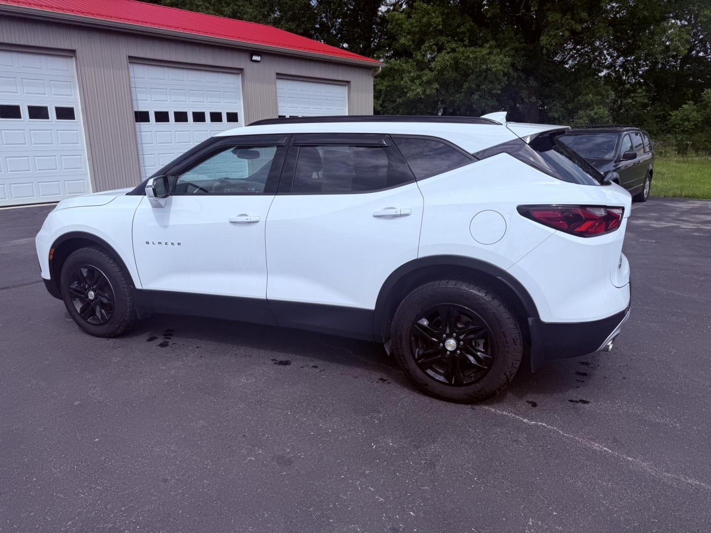2021 White /Black Chevrolet Blazer 2LT AWD (3GNKBHRS1MS) with an 3.6L V6 DOHC 24V engine, 9A transmission, located at 547 E. Main St., Orwell, OH, 44076, (440) 437-5893, 41.535435, -80.847855 - This 2021 Chevrolet Blazer 2LT AWD is a sporty midsize SUV powered by a 3.6L V6 engine and 9-speed automatic transmission, delivering a robust 0-60 mph time of 6.1 seconds and a 4,500-pound towing capacity. It features a power driver’s seat, heated front seats, dual-zone automatic climate control, - Photo#11