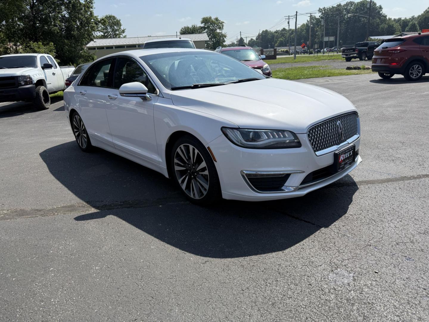 2017 White /Brown Lincoln MKZ Reserve AWD (3LN6L5FC1HR) with an 3.0 V6 TWIN TURBO engine, 6A transmission, located at 11115 Chardon Rd. , Chardon, OH, 44024, (440) 214-9705, 41.580246, -81.241943 - This 2017 Lincoln MKZ Reserve AWD with the 3.0L twin-turbo EcoBoost V6 engine delivers a luxurious and performance-oriented driving experience, producing 400 horsepower and accelerating from 0-60 mph in about 4.8 seconds. It features a refined leather interior with heated and cooled front seats, an - Photo#2