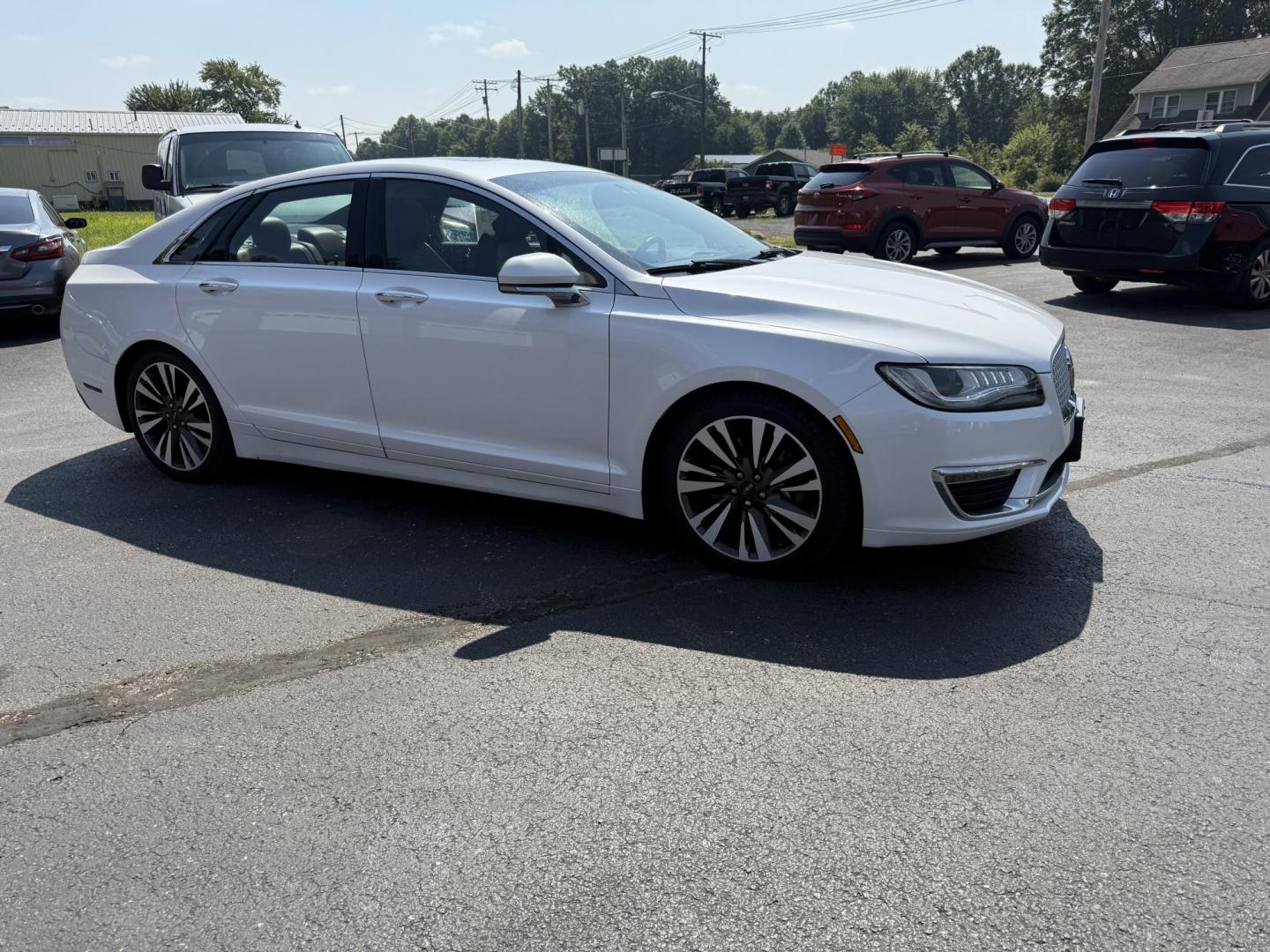 2017 White /Brown Lincoln MKZ Reserve AWD (3LN6L5FC1HR) with an 3.0 V6 TWIN TURBO engine, 6A transmission, located at 11115 Chardon Rd. , Chardon, OH, 44024, (440) 214-9705, 41.580246, -81.241943 - This 2017 Lincoln MKZ Reserve AWD with the 3.0L twin-turbo EcoBoost V6 engine delivers a luxurious and performance-oriented driving experience, producing 400 horsepower and accelerating from 0-60 mph in about 4.8 seconds. It features a refined leather interior with heated and cooled front seats, an - Photo#3