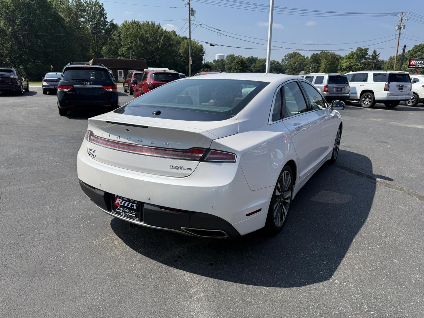 2017 White /Brown Lincoln MKZ Reserve AWD (3LN6L5FC1HR) with an 3.0 V6 TWIN TURBO engine, 6A transmission, located at 11115 Chardon Rd. , Chardon, OH, 44024, (440) 214-9705, 41.580246, -81.241943 - This 2017 Lincoln MKZ Reserve AWD with the 3.0L twin-turbo EcoBoost V6 engine delivers a luxurious and performance-oriented driving experience, producing 400 horsepower and accelerating from 0-60 mph in about 4.8 seconds. It features a refined leather interior with heated and cooled front seats, an - Photo#7