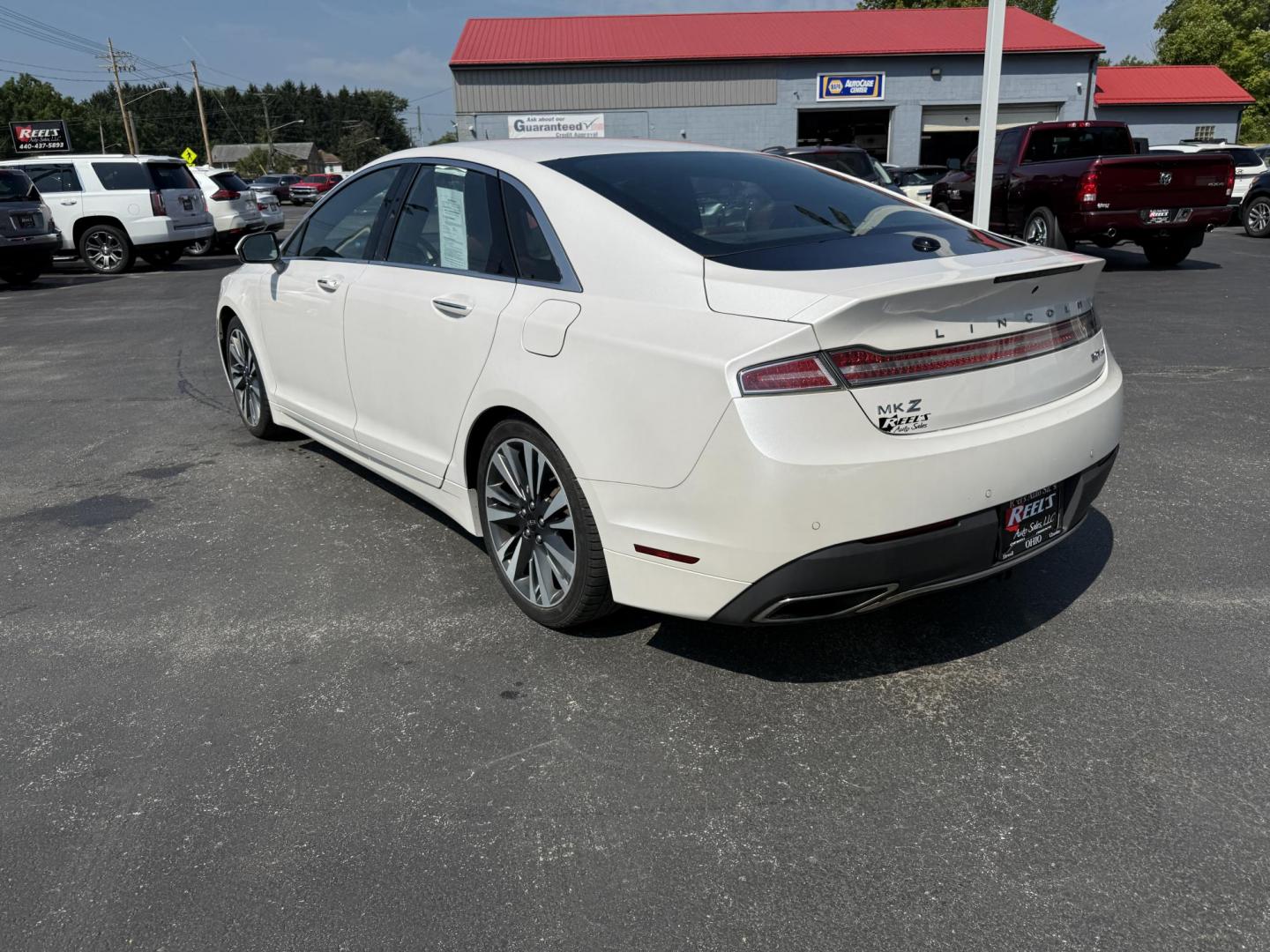 2017 White /Brown Lincoln MKZ Reserve AWD (3LN6L5FC1HR) with an 3.0 V6 TWIN TURBO engine, 6A transmission, located at 11115 Chardon Rd. , Chardon, OH, 44024, (440) 214-9705, 41.580246, -81.241943 - This 2017 Lincoln MKZ Reserve AWD with the 3.0L twin-turbo EcoBoost V6 engine delivers a luxurious and performance-oriented driving experience, producing 400 horsepower and accelerating from 0-60 mph in about 4.8 seconds. It features a refined leather interior with heated and cooled front seats, an - Photo#9