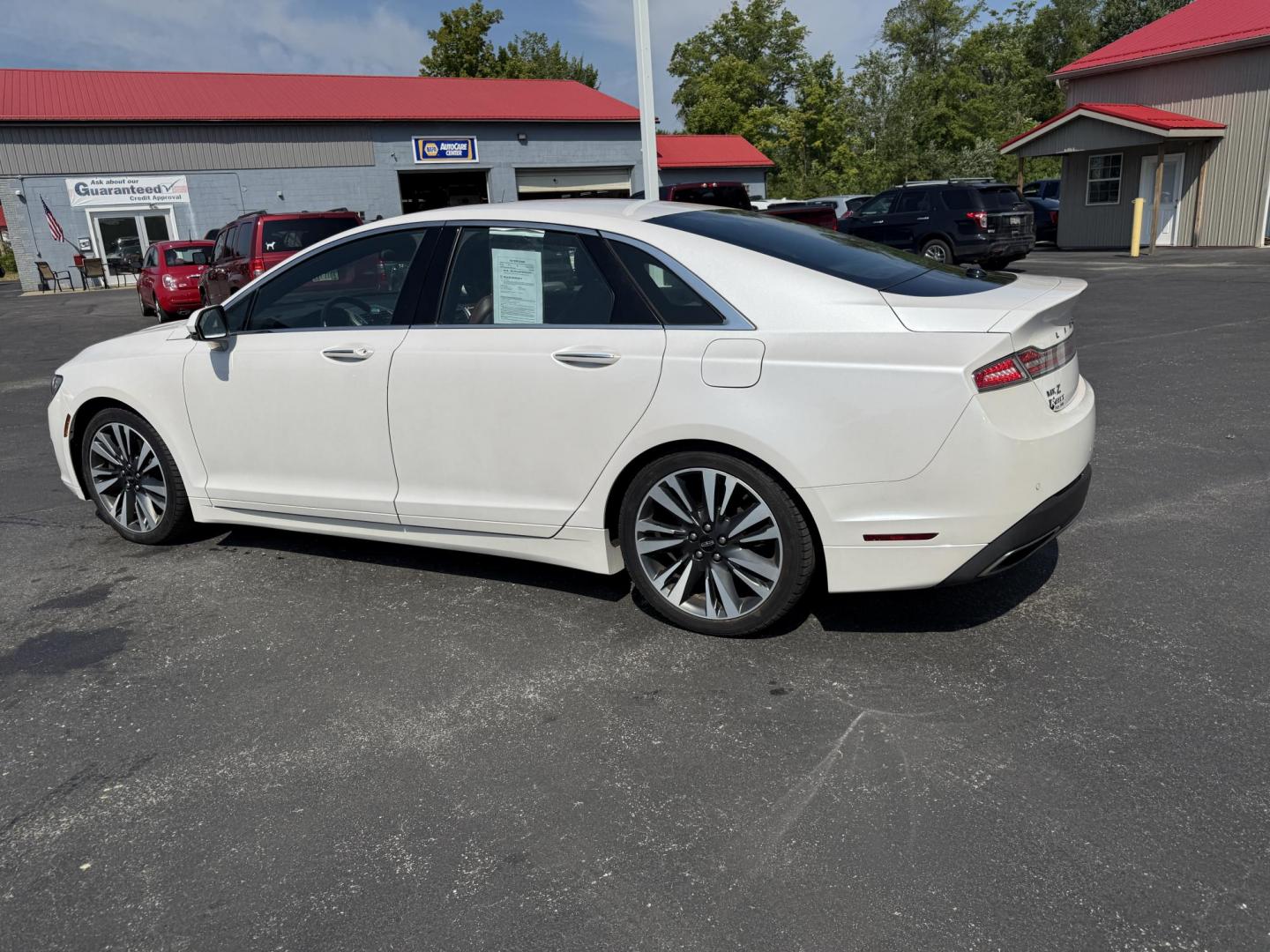 2017 White /Brown Lincoln MKZ Reserve AWD (3LN6L5FC1HR) with an 3.0 V6 TWIN TURBO engine, 6A transmission, located at 11115 Chardon Rd. , Chardon, OH, 44024, (440) 214-9705, 41.580246, -81.241943 - This 2017 Lincoln MKZ Reserve AWD with the 3.0L twin-turbo EcoBoost V6 engine delivers a luxurious and performance-oriented driving experience, producing 400 horsepower and accelerating from 0-60 mph in about 4.8 seconds. It features a refined leather interior with heated and cooled front seats, an - Photo#10
