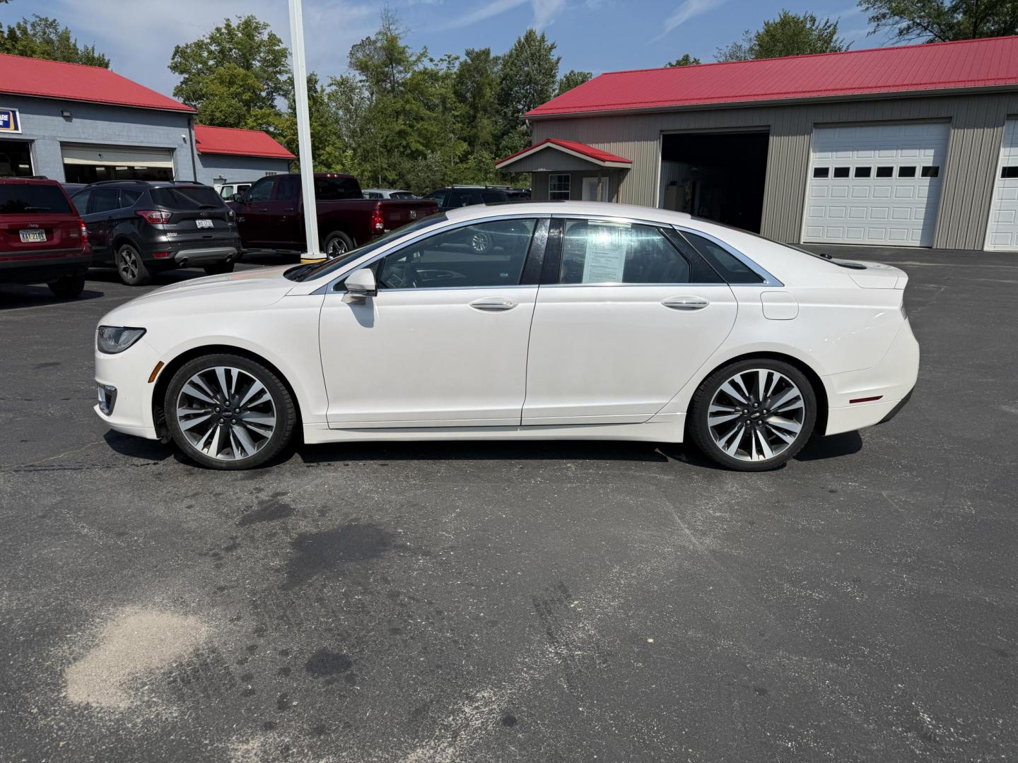 2017 White /Brown Lincoln MKZ Reserve AWD (3LN6L5FC1HR) with an 3.0 V6 TWIN TURBO engine, 6A transmission, located at 11115 Chardon Rd. , Chardon, OH, 44024, (440) 214-9705, 41.580246, -81.241943 - This 2017 Lincoln MKZ Reserve AWD with the 3.0L twin-turbo EcoBoost V6 engine delivers a luxurious and performance-oriented driving experience, producing 400 horsepower and accelerating from 0-60 mph in about 4.8 seconds. It features a refined leather interior with heated and cooled front seats, an - Photo#12