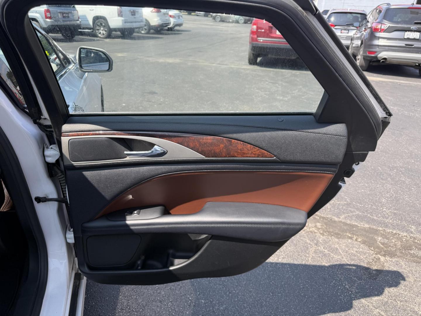 2017 White /Brown Lincoln MKZ Reserve AWD (3LN6L5FC1HR) with an 3.0 V6 TWIN TURBO engine, 6A transmission, located at 11115 Chardon Rd. , Chardon, OH, 44024, (440) 214-9705, 41.580246, -81.241943 - This 2017 Lincoln MKZ Reserve AWD with the 3.0L twin-turbo EcoBoost V6 engine delivers a luxurious and performance-oriented driving experience, producing 400 horsepower and accelerating from 0-60 mph in about 4.8 seconds. It features a refined leather interior with heated and cooled front seats, an - Photo#42