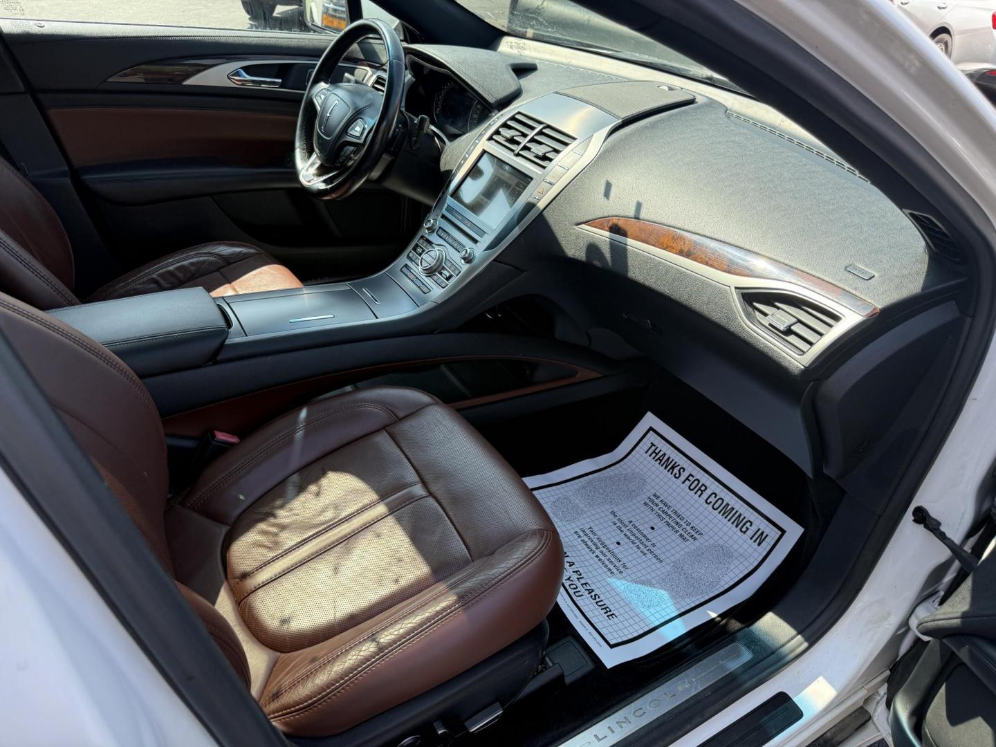 2017 White /Brown Lincoln MKZ Reserve AWD (3LN6L5FC1HR) with an 3.0 V6 TWIN TURBO engine, 6A transmission, located at 11115 Chardon Rd. , Chardon, OH, 44024, (440) 214-9705, 41.580246, -81.241943 - This 2017 Lincoln MKZ Reserve AWD with the 3.0L twin-turbo EcoBoost V6 engine delivers a luxurious and performance-oriented driving experience, producing 400 horsepower and accelerating from 0-60 mph in about 4.8 seconds. It features a refined leather interior with heated and cooled front seats, an - Photo#43