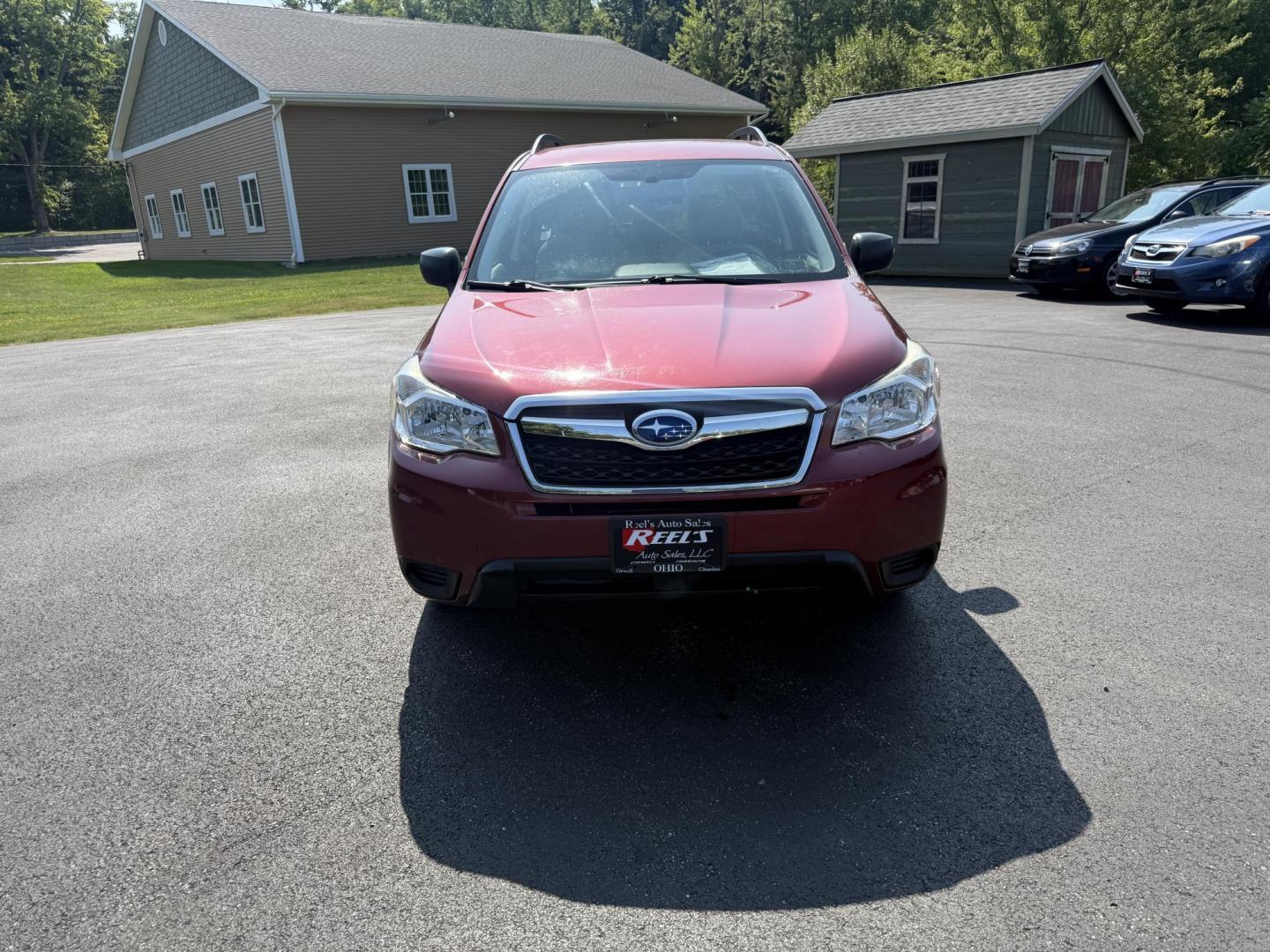 2015 Red /Gray Subaru Forester 2.5i (JF2SJABC5FH) with an 2.5L H4 DOHC 16V engine, Automatic transmission, located at 11115 Chardon Rd. , Chardon, OH, 44024, (440) 214-9705, 41.580246, -81.241943 - This One Owner 2015 Subaru Forester 2.5i features a 2.5-liter H4 (horizontally opposed 4-cylinder) engine paired with Subaru's signature Symmetrical All-Wheel Drive system, delivering reliable traction and stability in various driving conditions. It offers an impressive EPA-estimated 31 MPG on the h - Photo#1