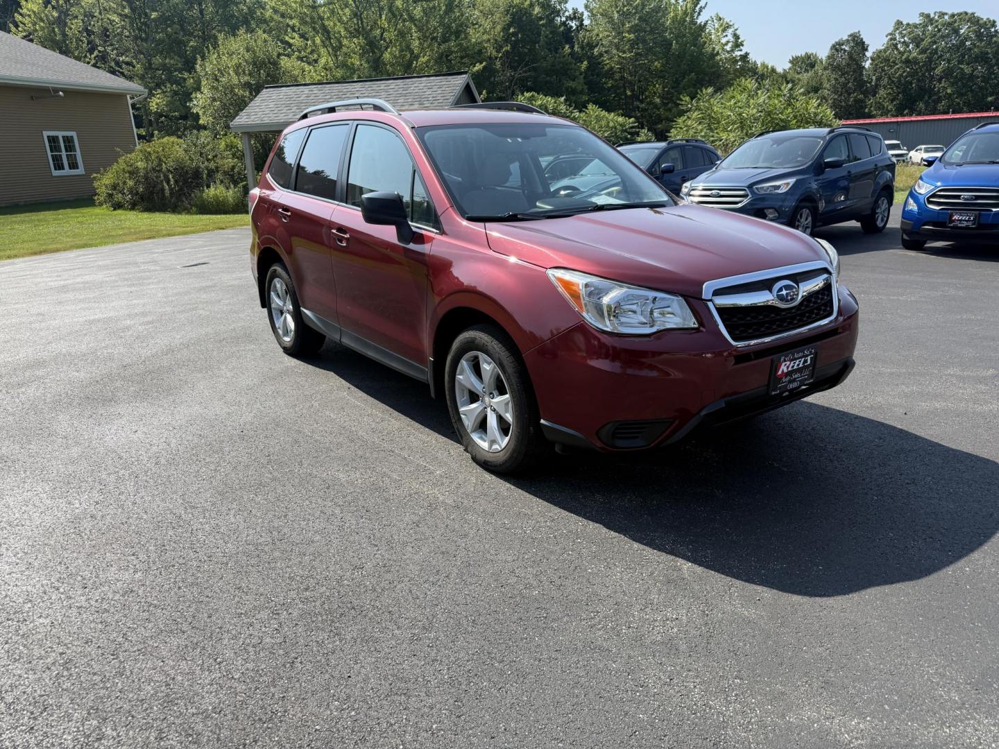 2015 Red /Gray Subaru Forester 2.5i (JF2SJABC5FH) with an 2.5L H4 DOHC 16V engine, Automatic transmission, located at 11115 Chardon Rd. , Chardon, OH, 44024, (440) 214-9705, 41.580246, -81.241943 - This One Owner 2015 Subaru Forester 2.5i features a 2.5-liter H4 (horizontally opposed 4-cylinder) engine paired with Subaru's signature Symmetrical All-Wheel Drive system, delivering reliable traction and stability in various driving conditions. It offers an impressive EPA-estimated 31 MPG on the h - Photo#2