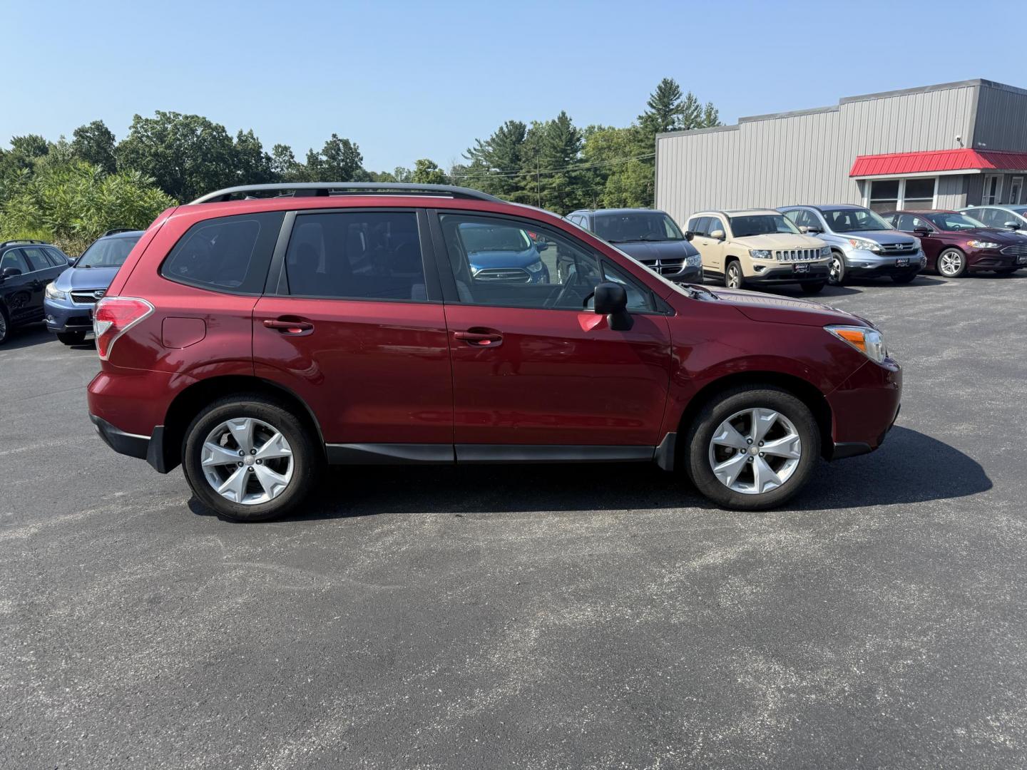 2015 Red /Gray Subaru Forester 2.5i (JF2SJABC5FH) with an 2.5L H4 DOHC 16V engine, Automatic transmission, located at 11115 Chardon Rd. , Chardon, OH, 44024, (440) 214-9705, 41.580246, -81.241943 - This One Owner 2015 Subaru Forester 2.5i features a 2.5-liter H4 (horizontally opposed 4-cylinder) engine paired with Subaru's signature Symmetrical All-Wheel Drive system, delivering reliable traction and stability in various driving conditions. It offers an impressive EPA-estimated 31 MPG on the h - Photo#5