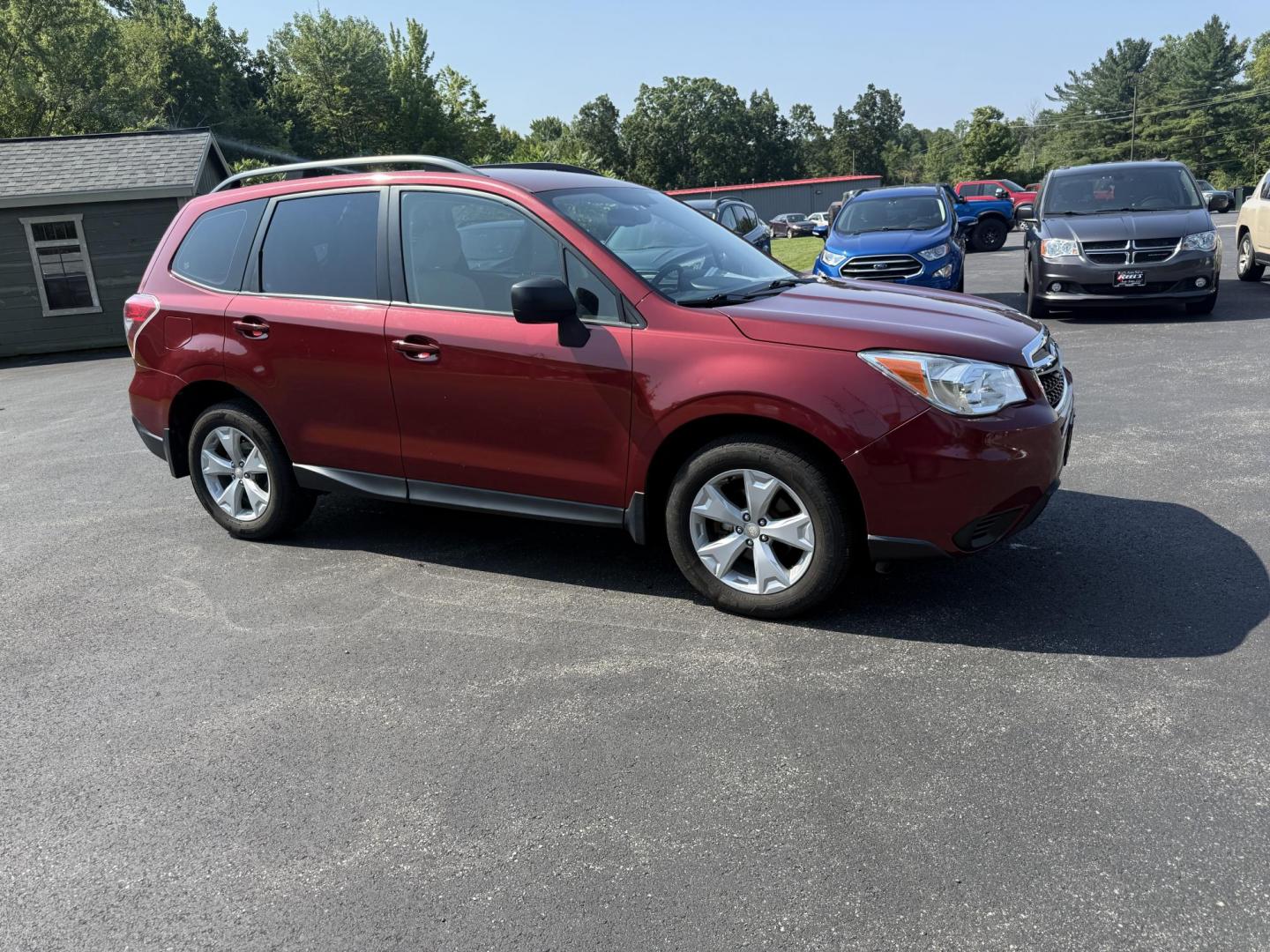 2015 Red /Gray Subaru Forester 2.5i (JF2SJABC5FH) with an 2.5L H4 DOHC 16V engine, Automatic transmission, located at 11115 Chardon Rd. , Chardon, OH, 44024, (440) 214-9705, 41.580246, -81.241943 - This One Owner 2015 Subaru Forester 2.5i features a 2.5-liter H4 (horizontally opposed 4-cylinder) engine paired with Subaru's signature Symmetrical All-Wheel Drive system, delivering reliable traction and stability in various driving conditions. It offers an impressive EPA-estimated 31 MPG on the h - Photo#3