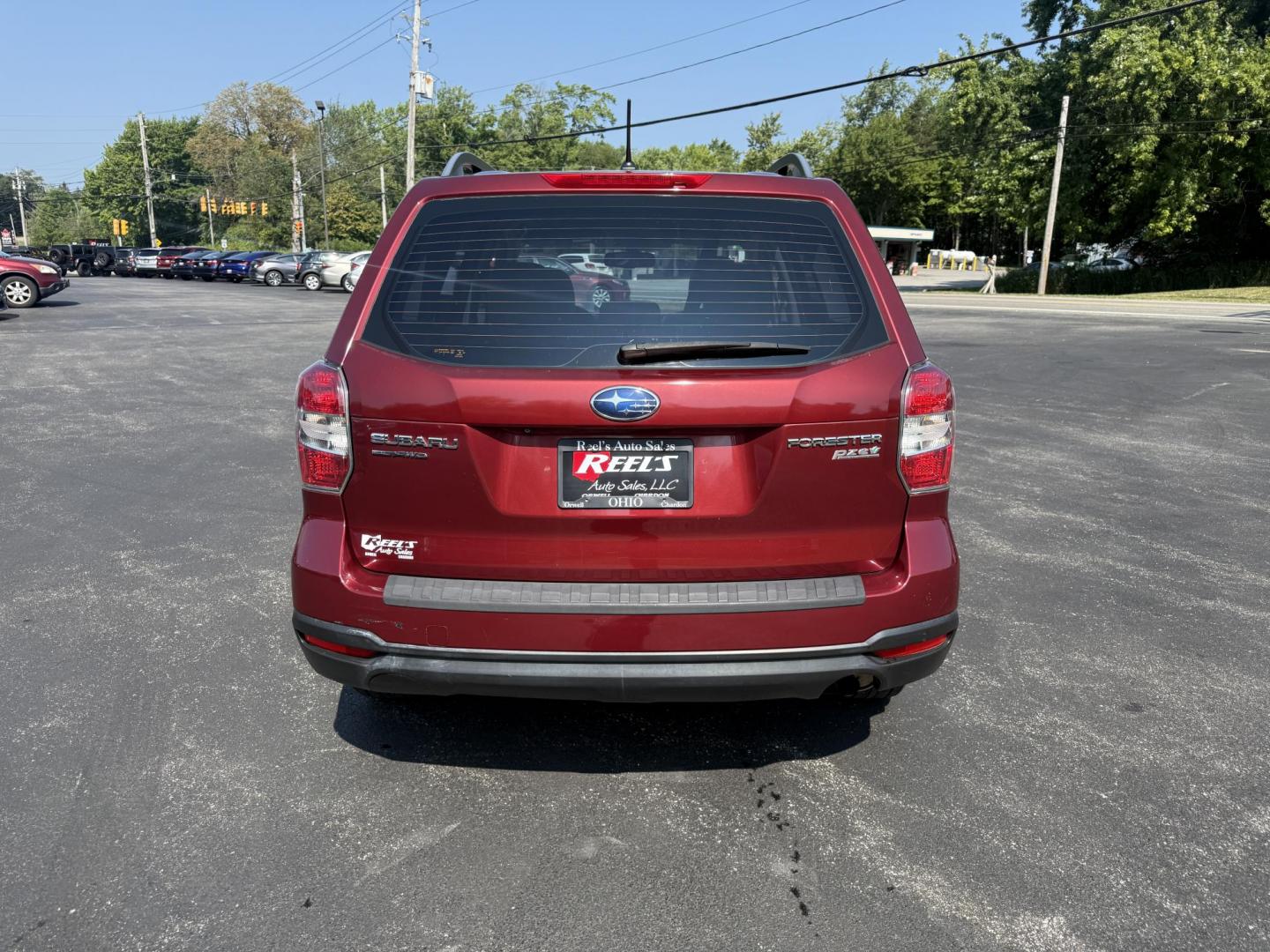 2015 Red /Gray Subaru Forester 2.5i (JF2SJABC5FH) with an 2.5L H4 DOHC 16V engine, Automatic transmission, located at 11115 Chardon Rd. , Chardon, OH, 44024, (440) 214-9705, 41.580246, -81.241943 - This One Owner 2015 Subaru Forester 2.5i features a 2.5-liter H4 (horizontally opposed 4-cylinder) engine paired with Subaru's signature Symmetrical All-Wheel Drive system, delivering reliable traction and stability in various driving conditions. It offers an impressive EPA-estimated 31 MPG on the h - Photo#8