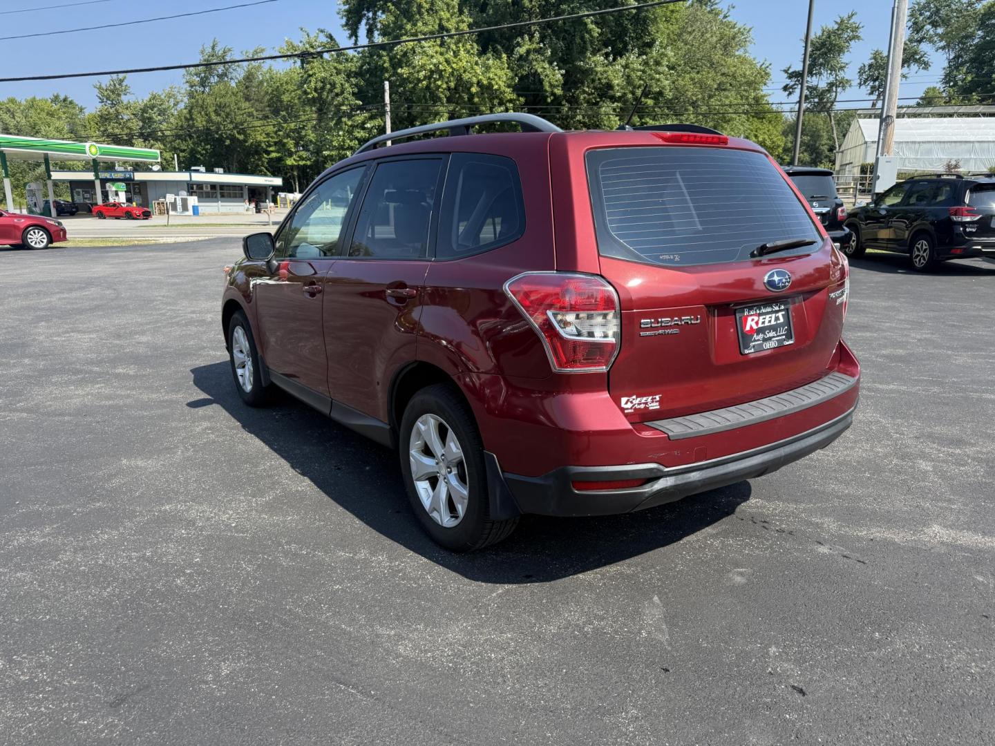 2015 Red /Gray Subaru Forester 2.5i (JF2SJABC5FH) with an 2.5L H4 DOHC 16V engine, Automatic transmission, located at 11115 Chardon Rd. , Chardon, OH, 44024, (440) 214-9705, 41.580246, -81.241943 - This One Owner 2015 Subaru Forester 2.5i features a 2.5-liter H4 (horizontally opposed 4-cylinder) engine paired with Subaru's signature Symmetrical All-Wheel Drive system, delivering reliable traction and stability in various driving conditions. It offers an impressive EPA-estimated 31 MPG on the h - Photo#9