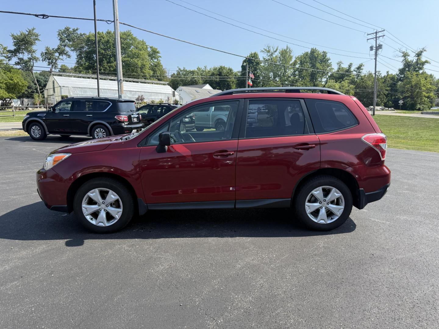 2015 Red /Gray Subaru Forester 2.5i (JF2SJABC5FH) with an 2.5L H4 DOHC 16V engine, Automatic transmission, located at 11115 Chardon Rd. , Chardon, OH, 44024, (440) 214-9705, 41.580246, -81.241943 - This One Owner 2015 Subaru Forester 2.5i features a 2.5-liter H4 (horizontally opposed 4-cylinder) engine paired with Subaru's signature Symmetrical All-Wheel Drive system, delivering reliable traction and stability in various driving conditions. It offers an impressive EPA-estimated 31 MPG on the h - Photo#12