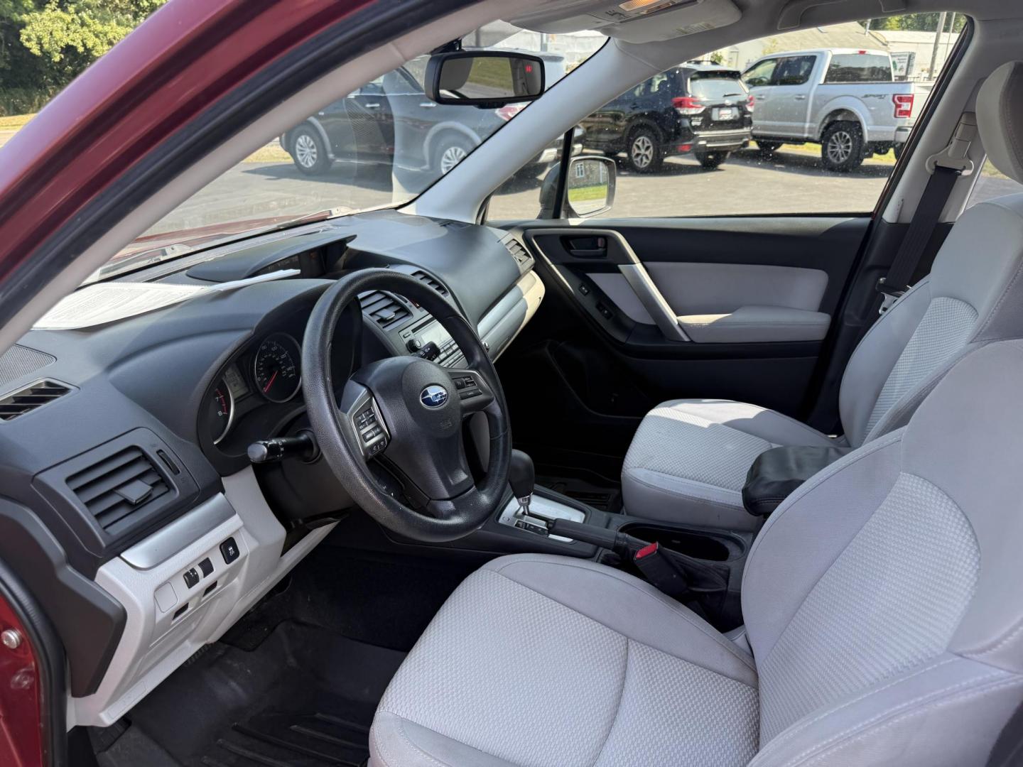 2015 Red /Gray Subaru Forester 2.5i (JF2SJABC5FH) with an 2.5L H4 DOHC 16V engine, Automatic transmission, located at 11115 Chardon Rd. , Chardon, OH, 44024, (440) 214-9705, 41.580246, -81.241943 - This One Owner 2015 Subaru Forester 2.5i features a 2.5-liter H4 (horizontally opposed 4-cylinder) engine paired with Subaru's signature Symmetrical All-Wheel Drive system, delivering reliable traction and stability in various driving conditions. It offers an impressive EPA-estimated 31 MPG on the h - Photo#15
