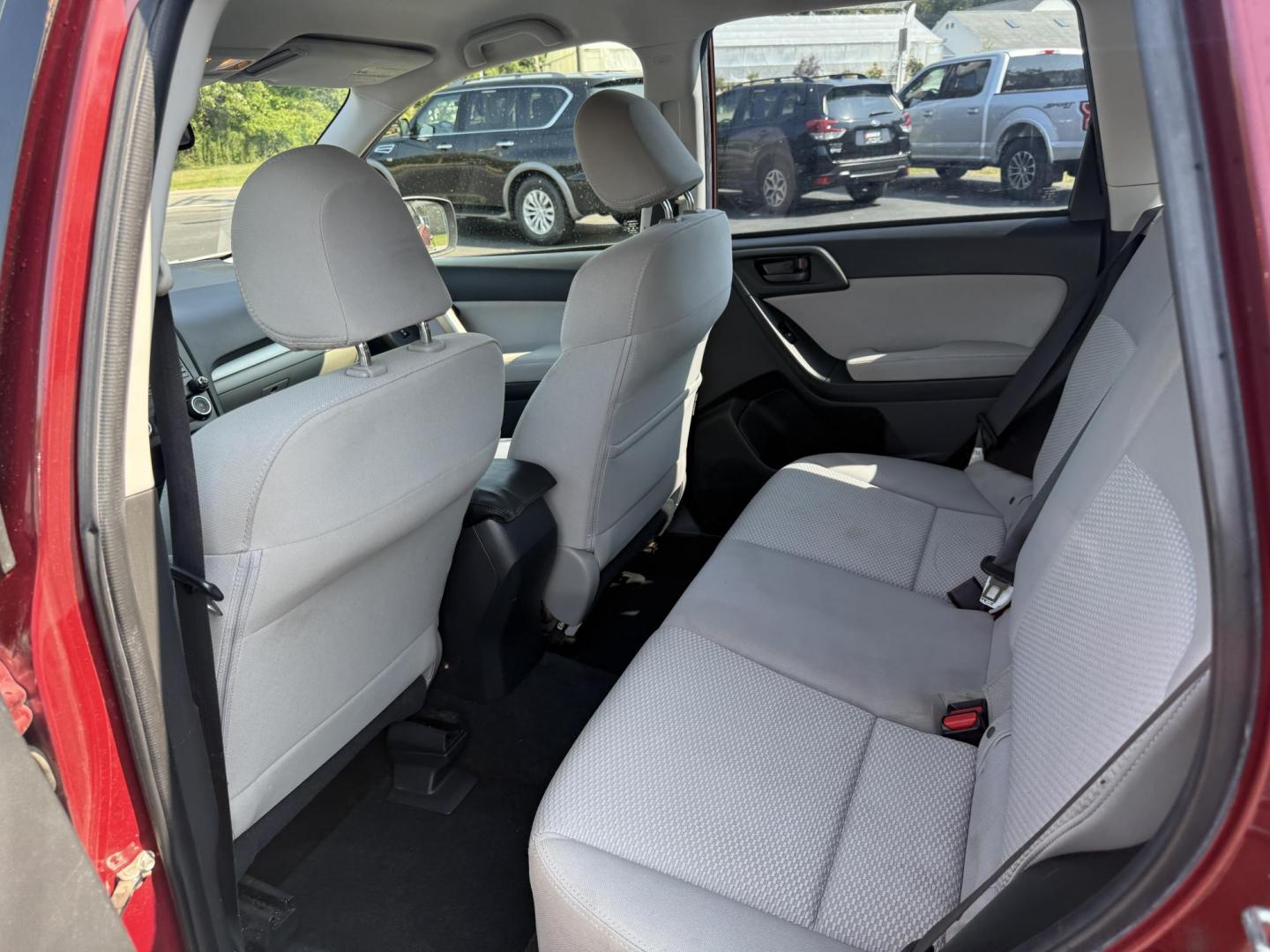 2015 Red /Gray Subaru Forester 2.5i (JF2SJABC5FH) with an 2.5L H4 DOHC 16V engine, Automatic transmission, located at 11115 Chardon Rd. , Chardon, OH, 44024, (440) 214-9705, 41.580246, -81.241943 - This One Owner 2015 Subaru Forester 2.5i features a 2.5-liter H4 (horizontally opposed 4-cylinder) engine paired with Subaru's signature Symmetrical All-Wheel Drive system, delivering reliable traction and stability in various driving conditions. It offers an impressive EPA-estimated 31 MPG on the h - Photo#29