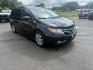 2014 Black /Gray Honda Odyssey EX-L (5FNRL5H6XEB) with an 3.5L V6 SOHC 24V engine, 6-Speed Automatic transmission, located at 547 E. Main St., Orwell, OH, 44076, (440) 437-5893, 41.535435, -80.847855 - This 2014 Honda Odyssey EX-L with Navigation is a well-equipped minivan featuring a 3.5L V6 engine and a 6-speed automatic transmission, delivering up to 27 MPG on the highway. It offers a comfortable ride with leather, heated, and power front seats, tri-zone automatic climate control, and a power m - Photo#2