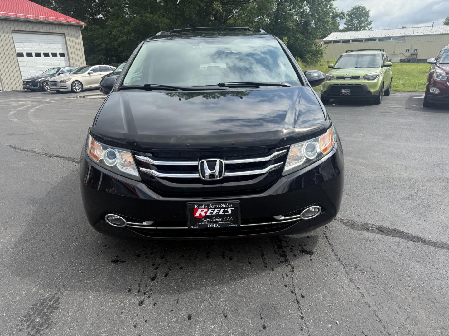2014 Black /Gray Honda Odyssey EX-L (5FNRL5H6XEB) with an 3.5L V6 SOHC 24V engine, 6-Speed Automatic transmission, located at 547 E. Main St., Orwell, OH, 44076, (440) 437-5893, 41.535435, -80.847855 - This 2014 Honda Odyssey EX-L with Navigation is a well-equipped minivan featuring a 3.5L V6 engine and a 6-speed automatic transmission, delivering up to 27 MPG on the highway. It offers a comfortable ride with leather, heated, and power front seats, tri-zone automatic climate control, and a power m - Photo#1