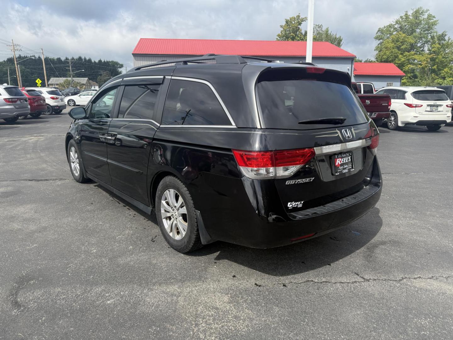 2014 Black /Gray Honda Odyssey EX-L (5FNRL5H6XEB) with an 3.5L V6 SOHC 24V engine, 6-Speed Automatic transmission, located at 547 E. Main St., Orwell, OH, 44076, (440) 437-5893, 41.535435, -80.847855 - This 2014 Honda Odyssey EX-L with Navigation is a well-equipped minivan featuring a 3.5L V6 engine and a 6-speed automatic transmission, delivering up to 27 MPG on the highway. It offers a comfortable ride with leather, heated, and power front seats, tri-zone automatic climate control, and a power m - Photo#9