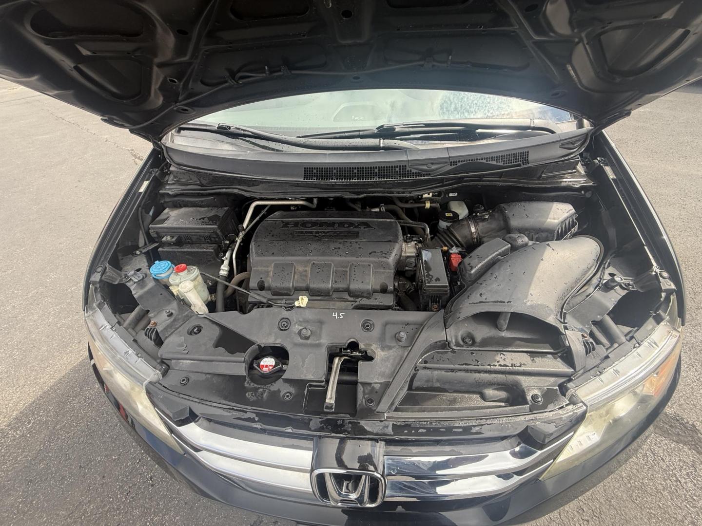 2014 Black /Gray Honda Odyssey EX-L (5FNRL5H6XEB) with an 3.5L V6 SOHC 24V engine, 6-Speed Automatic transmission, located at 547 E. Main St., Orwell, OH, 44076, (440) 437-5893, 41.535435, -80.847855 - This 2014 Honda Odyssey EX-L with Navigation is a well-equipped minivan featuring a 3.5L V6 engine and a 6-speed automatic transmission, delivering up to 27 MPG on the highway. It offers a comfortable ride with leather, heated, and power front seats, tri-zone automatic climate control, and a power m - Photo#14