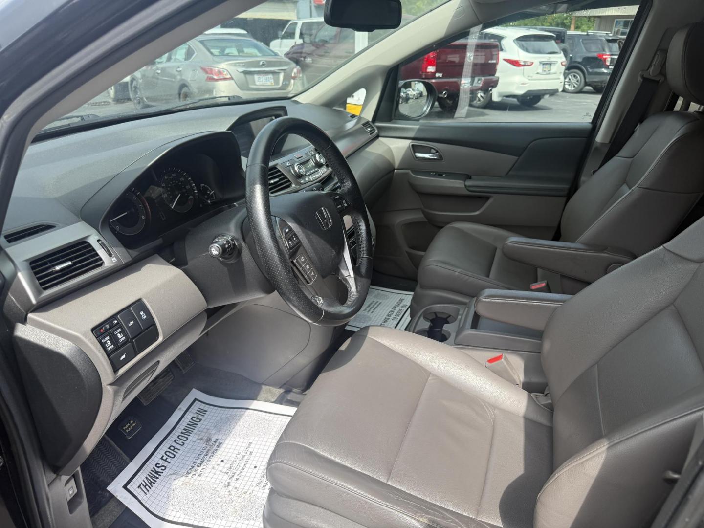 2014 Black /Gray Honda Odyssey EX-L (5FNRL5H6XEB) with an 3.5L V6 SOHC 24V engine, 6-Speed Automatic transmission, located at 547 E. Main St., Orwell, OH, 44076, (440) 437-5893, 41.535435, -80.847855 - This 2014 Honda Odyssey EX-L with Navigation is a well-equipped minivan featuring a 3.5L V6 engine and a 6-speed automatic transmission, delivering up to 27 MPG on the highway. It offers a comfortable ride with leather, heated, and power front seats, tri-zone automatic climate control, and a power m - Photo#15