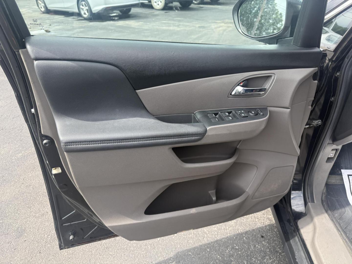 2014 Black /Gray Honda Odyssey EX-L (5FNRL5H6XEB) with an 3.5L V6 SOHC 24V engine, 6-Speed Automatic transmission, located at 547 E. Main St., Orwell, OH, 44076, (440) 437-5893, 41.535435, -80.847855 - This 2014 Honda Odyssey EX-L with Navigation is a well-equipped minivan featuring a 3.5L V6 engine and a 6-speed automatic transmission, delivering up to 27 MPG on the highway. It offers a comfortable ride with leather, heated, and power front seats, tri-zone automatic climate control, and a power m - Photo#16