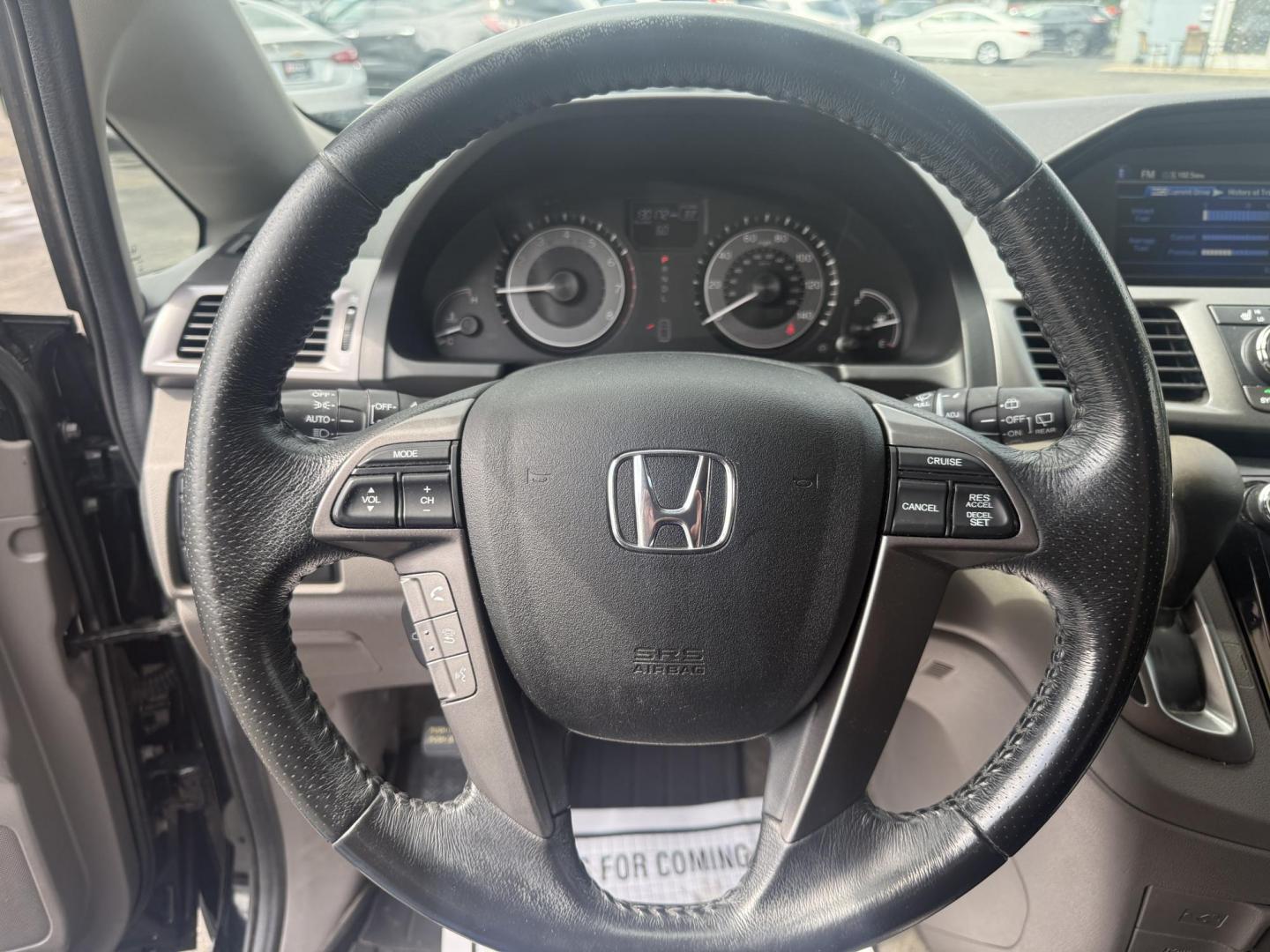 2014 Black /Gray Honda Odyssey EX-L (5FNRL5H6XEB) with an 3.5L V6 SOHC 24V engine, 6-Speed Automatic transmission, located at 547 E. Main St., Orwell, OH, 44076, (440) 437-5893, 41.535435, -80.847855 - This 2014 Honda Odyssey EX-L with Navigation is a well-equipped minivan featuring a 3.5L V6 engine and a 6-speed automatic transmission, delivering up to 27 MPG on the highway. It offers a comfortable ride with leather, heated, and power front seats, tri-zone automatic climate control, and a power m - Photo#24