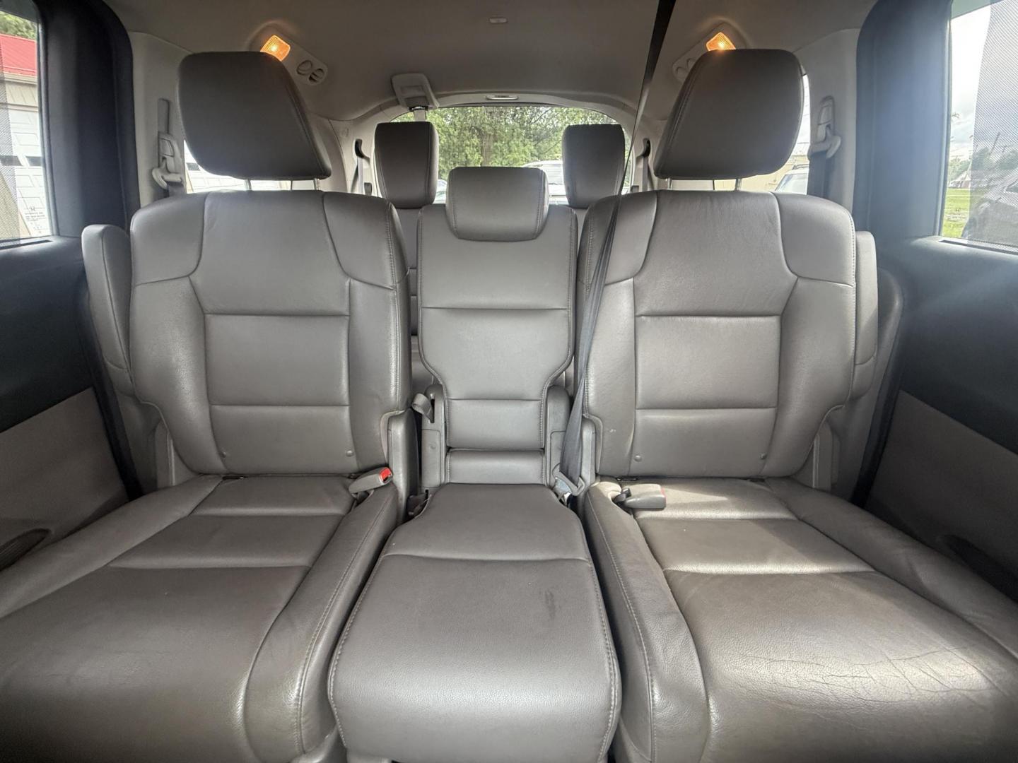 2014 Black /Gray Honda Odyssey EX-L (5FNRL5H6XEB) with an 3.5L V6 SOHC 24V engine, 6-Speed Automatic transmission, located at 547 E. Main St., Orwell, OH, 44076, (440) 437-5893, 41.535435, -80.847855 - This 2014 Honda Odyssey EX-L with Navigation is a well-equipped minivan featuring a 3.5L V6 engine and a 6-speed automatic transmission, delivering up to 27 MPG on the highway. It offers a comfortable ride with leather, heated, and power front seats, tri-zone automatic climate control, and a power m - Photo#37