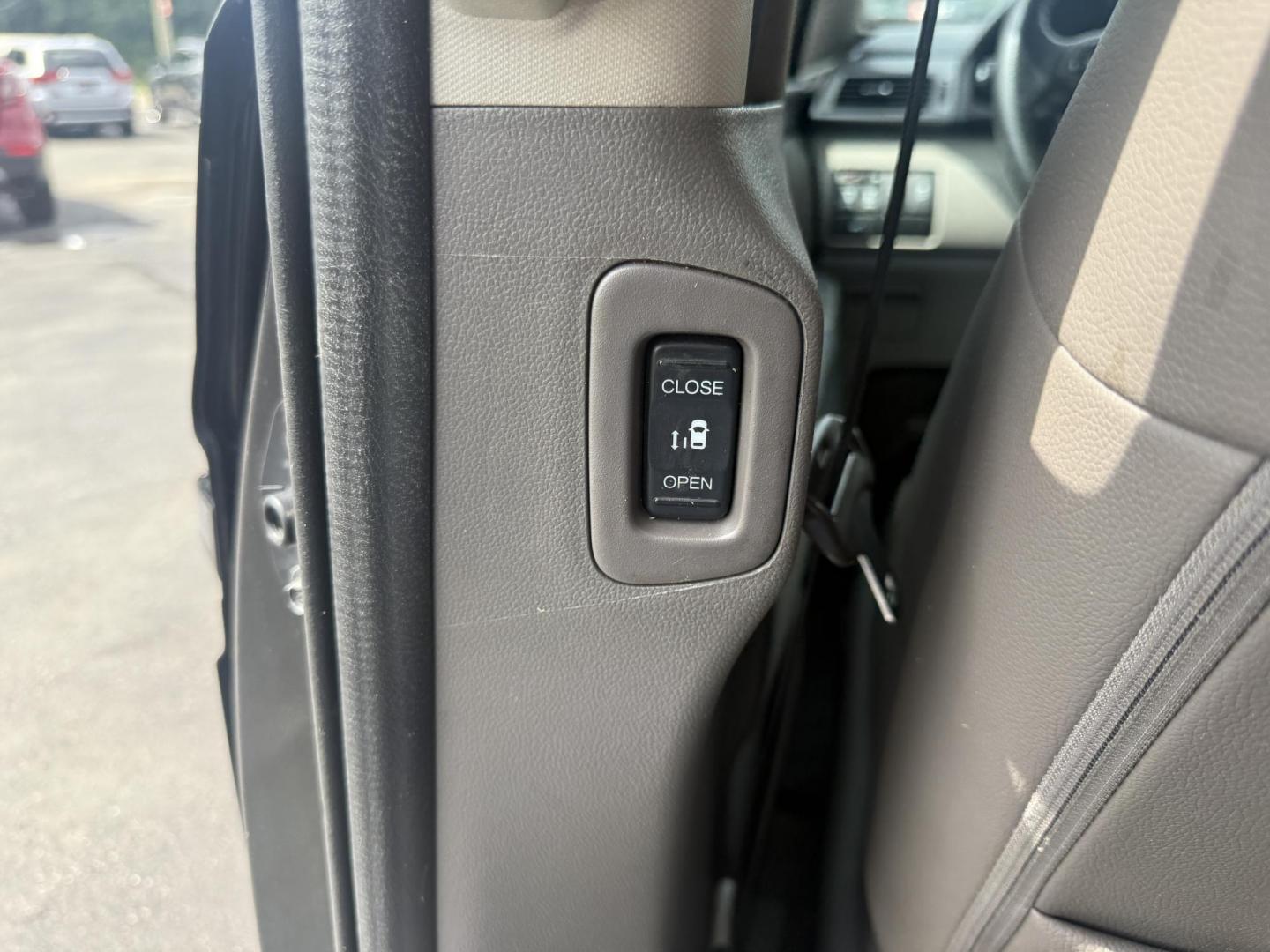 2014 Black /Gray Honda Odyssey EX-L (5FNRL5H6XEB) with an 3.5L V6 SOHC 24V engine, 6-Speed Automatic transmission, located at 547 E. Main St., Orwell, OH, 44076, (440) 437-5893, 41.535435, -80.847855 - This 2014 Honda Odyssey EX-L with Navigation is a well-equipped minivan featuring a 3.5L V6 engine and a 6-speed automatic transmission, delivering up to 27 MPG on the highway. It offers a comfortable ride with leather, heated, and power front seats, tri-zone automatic climate control, and a power m - Photo#39
