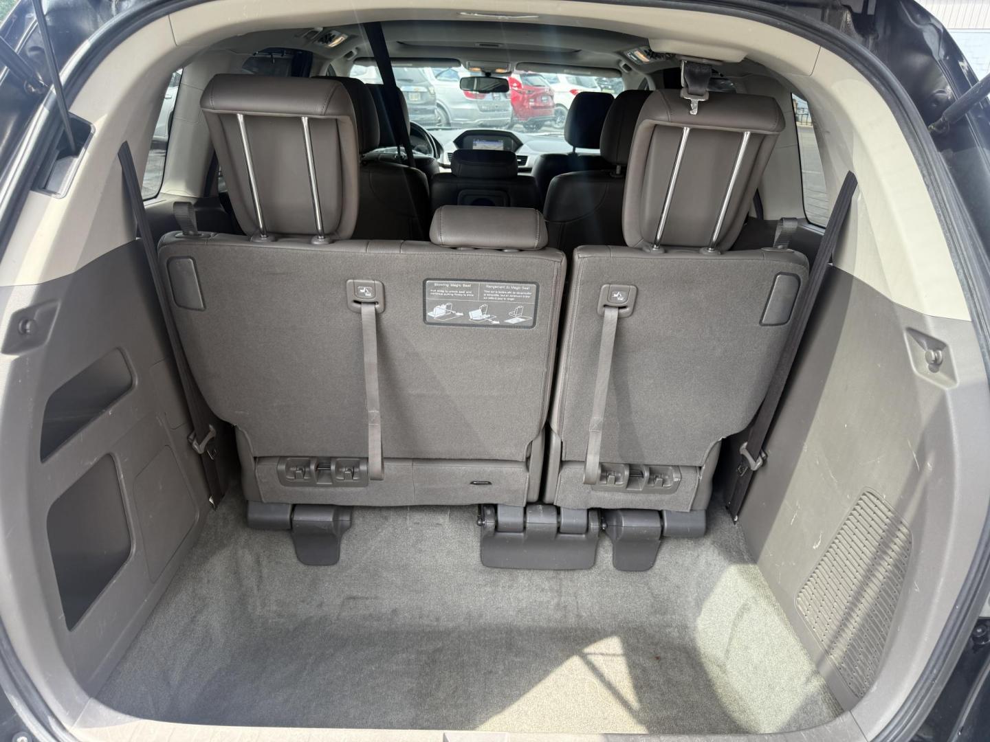 2014 Black /Gray Honda Odyssey EX-L (5FNRL5H6XEB) with an 3.5L V6 SOHC 24V engine, 6-Speed Automatic transmission, located at 547 E. Main St., Orwell, OH, 44076, (440) 437-5893, 41.535435, -80.847855 - This 2014 Honda Odyssey EX-L with Navigation is a well-equipped minivan featuring a 3.5L V6 engine and a 6-speed automatic transmission, delivering up to 27 MPG on the highway. It offers a comfortable ride with leather, heated, and power front seats, tri-zone automatic climate control, and a power m - Photo#41