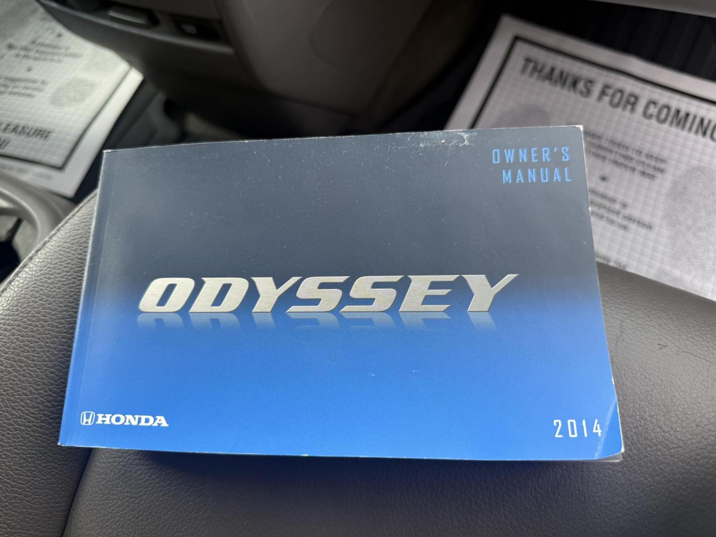 2014 Black /Gray Honda Odyssey EX-L (5FNRL5H6XEB) with an 3.5L V6 SOHC 24V engine, 6-Speed Automatic transmission, located at 547 E. Main St., Orwell, OH, 44076, (440) 437-5893, 41.535435, -80.847855 - This 2014 Honda Odyssey EX-L with Navigation is a well-equipped minivan featuring a 3.5L V6 engine and a 6-speed automatic transmission, delivering up to 27 MPG on the highway. It offers a comfortable ride with leather, heated, and power front seats, tri-zone automatic climate control, and a power m - Photo#46