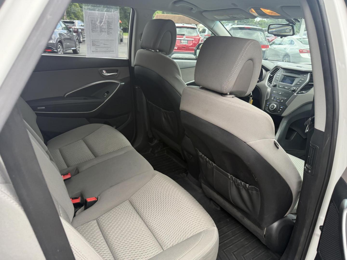 2016 White /Gray Hyundai Santa Fe SE AWD (KM8SMDHF7GU) with an 3.3L V6 DOHC 24V engine, 6A transmission, located at 547 E. Main St., Orwell, OH, 44076, (440) 437-5893, 41.535435, -80.847855 - Photo#39