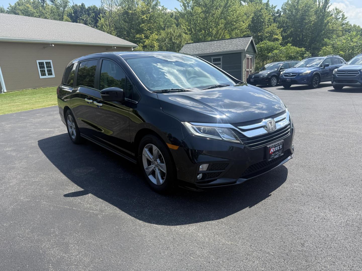 2018 Black /Gray Honda Odyssey EX (5FNRL6H53JB) with an 3.5L V6 SOHC 24V engine, 9 Speed Automatic transmission, located at 11115 Chardon Rd. , Chardon, OH, 44024, (440) 214-9705, 41.580246, -81.241943 - This 2018 Honda Odyssey EX is a family-friendly minivan powered by a 3.5L V6 engine paired with a 9-speed automatic transmission, achieving approximately 28 MPG on the highway. It features an 8.0" touchscreen infotainment system, a 7.0" gauge cluster screen, and supports Apple CarPlay and Android Au - Photo#2