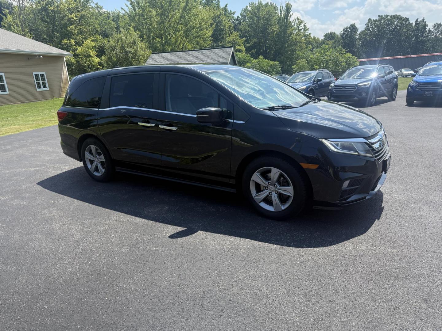 2018 Black /Gray Honda Odyssey EX (5FNRL6H53JB) with an 3.5L V6 SOHC 24V engine, 9 Speed Automatic transmission, located at 11115 Chardon Rd. , Chardon, OH, 44024, (440) 214-9705, 41.580246, -81.241943 - This 2018 Honda Odyssey EX is a family-friendly minivan powered by a 3.5L V6 engine paired with a 9-speed automatic transmission, achieving approximately 28 MPG on the highway. It features an 8.0" touchscreen infotainment system, a 7.0" gauge cluster screen, and supports Apple CarPlay and Android Au - Photo#3