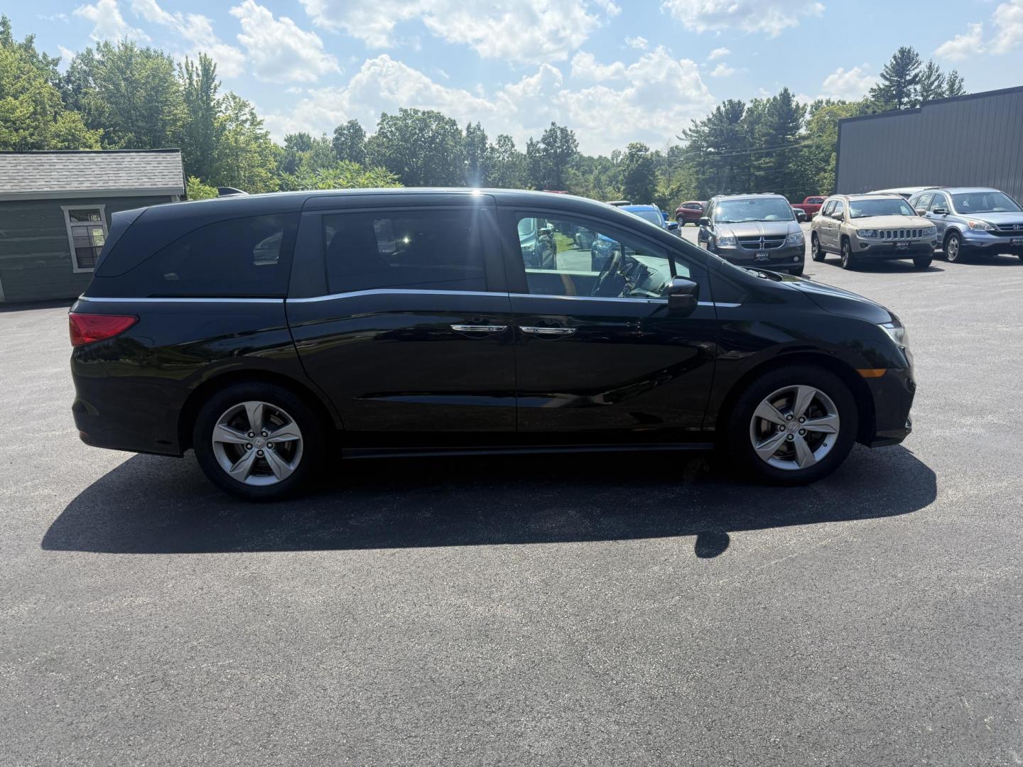 2018 Black /Gray Honda Odyssey EX (5FNRL6H53JB) with an 3.5L V6 SOHC 24V engine, 9 Speed Automatic transmission, located at 11115 Chardon Rd. , Chardon, OH, 44024, (440) 214-9705, 41.580246, -81.241943 - This 2018 Honda Odyssey EX is a family-friendly minivan powered by a 3.5L V6 engine paired with a 9-speed automatic transmission, achieving approximately 28 MPG on the highway. It features an 8.0" touchscreen infotainment system, a 7.0" gauge cluster screen, and supports Apple CarPlay and Android Au - Photo#5