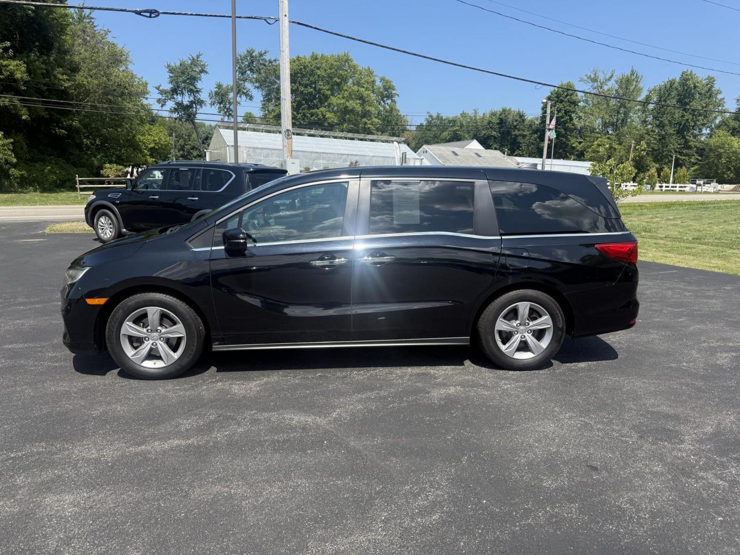 2018 Black /Gray Honda Odyssey EX (5FNRL6H53JB) with an 3.5L V6 SOHC 24V engine, 9 Speed Automatic transmission, located at 11115 Chardon Rd. , Chardon, OH, 44024, (440) 214-9705, 41.580246, -81.241943 - This 2018 Honda Odyssey EX is a family-friendly minivan powered by a 3.5L V6 engine paired with a 9-speed automatic transmission, achieving approximately 28 MPG on the highway. It features an 8.0" touchscreen infotainment system, a 7.0" gauge cluster screen, and supports Apple CarPlay and Android Au - Photo#11