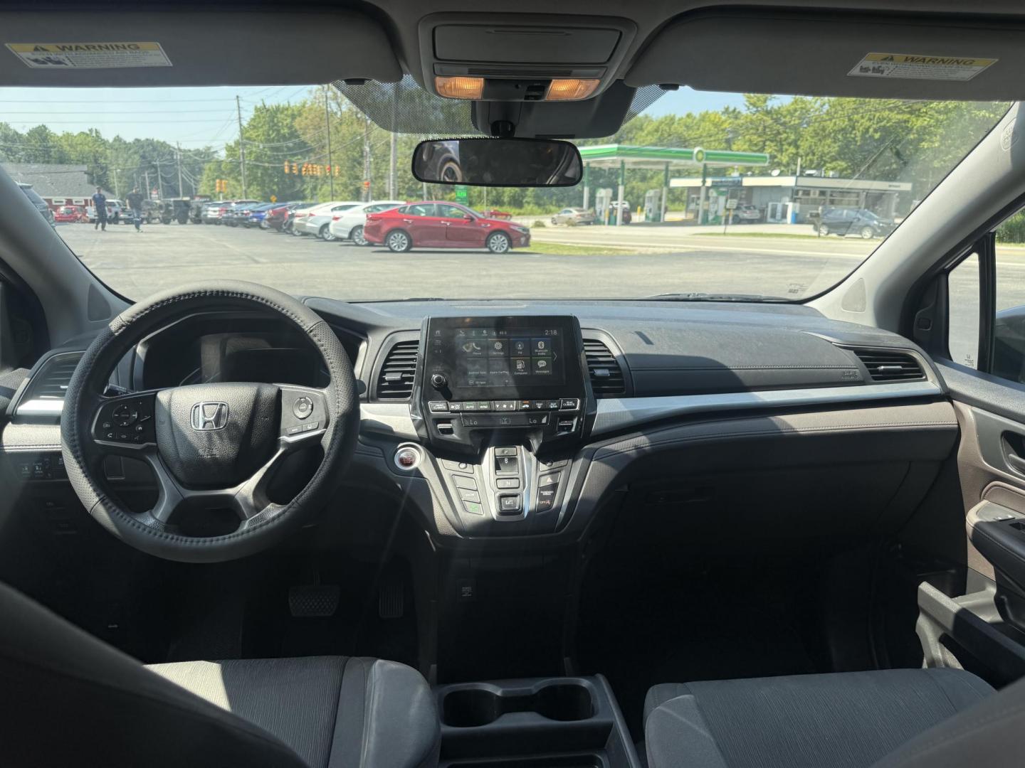 2018 Black /Gray Honda Odyssey EX (5FNRL6H53JB) with an 3.5L V6 SOHC 24V engine, 9 Speed Automatic transmission, located at 11115 Chardon Rd. , Chardon, OH, 44024, (440) 214-9705, 41.580246, -81.241943 - This 2018 Honda Odyssey EX is a family-friendly minivan powered by a 3.5L V6 engine paired with a 9-speed automatic transmission, achieving approximately 28 MPG on the highway. It features an 8.0" touchscreen infotainment system, a 7.0" gauge cluster screen, and supports Apple CarPlay and Android Au - Photo#31
