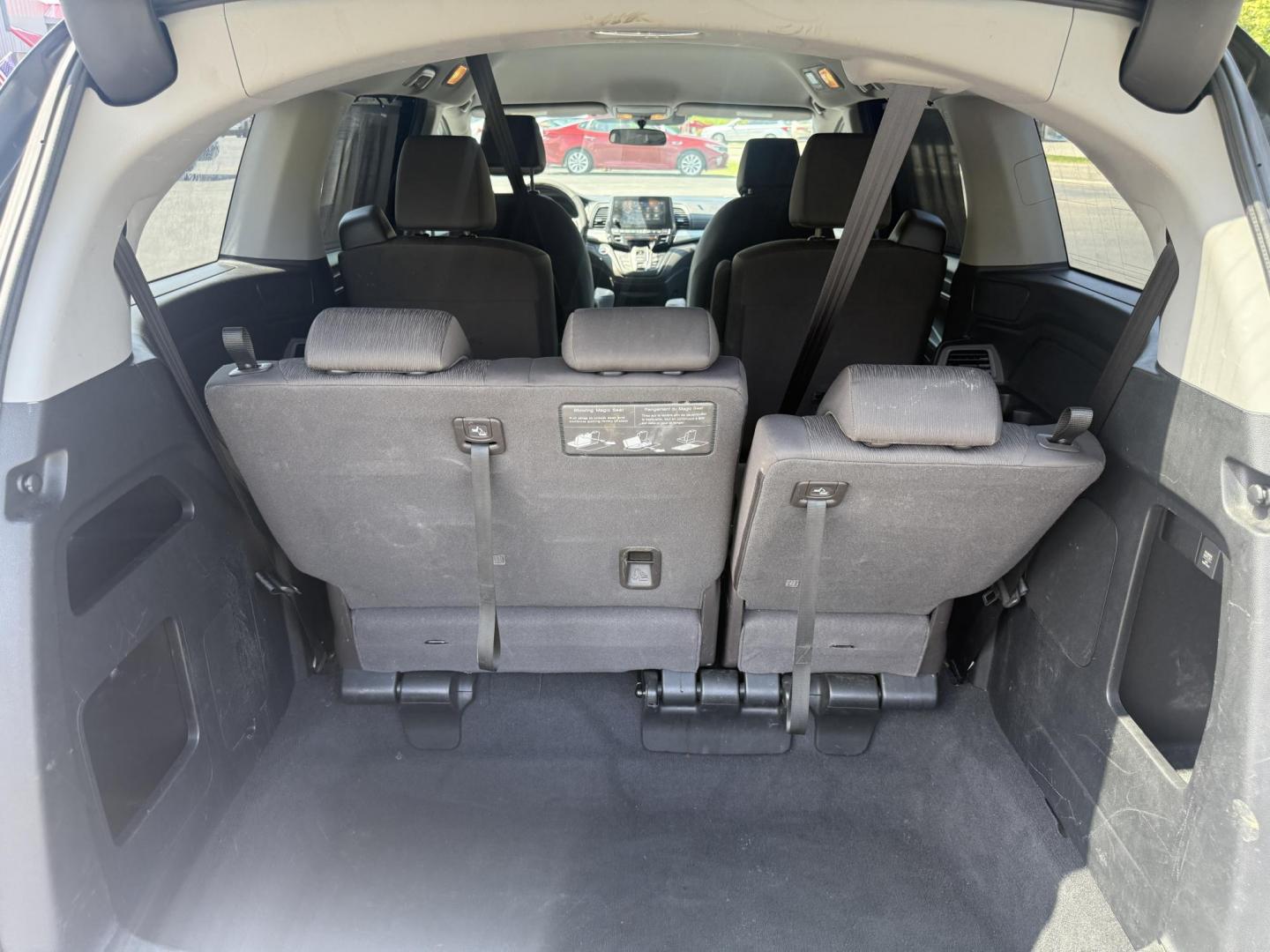 2018 Black /Gray Honda Odyssey EX (5FNRL6H53JB) with an 3.5L V6 SOHC 24V engine, 9 Speed Automatic transmission, located at 11115 Chardon Rd. , Chardon, OH, 44024, (440) 214-9705, 41.580246, -81.241943 - This 2018 Honda Odyssey EX is a family-friendly minivan powered by a 3.5L V6 engine paired with a 9-speed automatic transmission, achieving approximately 28 MPG on the highway. It features an 8.0" touchscreen infotainment system, a 7.0" gauge cluster screen, and supports Apple CarPlay and Android Au - Photo#32