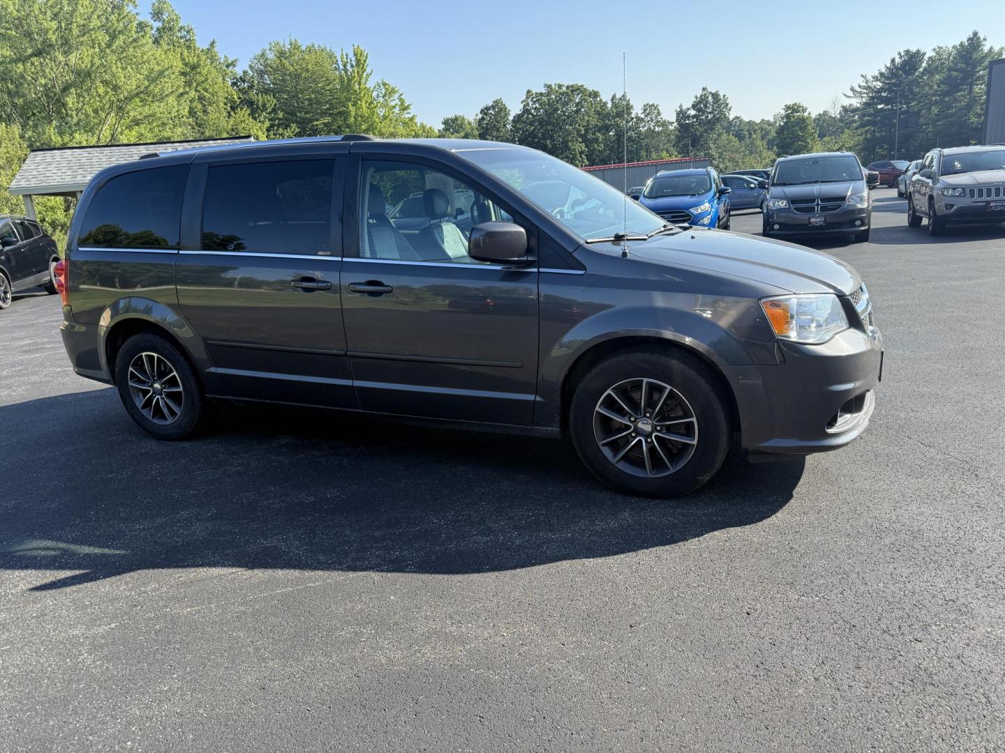 2017 Gray /Black Dodge Grand Caravan SE (2C4RDGBG0HR) with an 3.6L V6 DOHC 24V FFV engine, 6A transmission, located at 11115 Chardon Rd. , Chardon, OH, 44024, (440) 214-9705, 41.580246, -81.241943 - This 2017 Dodge Grand Caravan SE is a versatile minivan powered by a 3.6L Pentastar V6 engine with a 6-speed automatic transmission, offering practical features like daytime running lights, flex-fuel capability, and a power driver's seat. It provides comfortable seating with 2nd-row captain’s chai - Photo#3