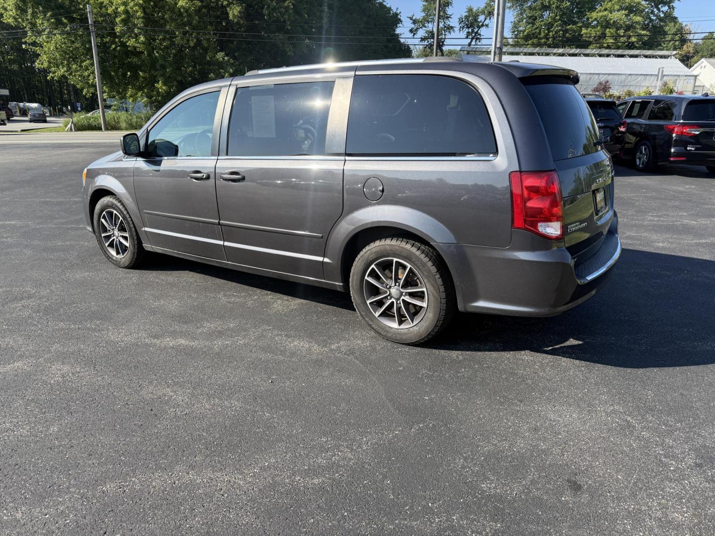 2017 Gray /Black Dodge Grand Caravan SE (2C4RDGBG0HR) with an 3.6L V6 DOHC 24V FFV engine, 6A transmission, located at 11115 Chardon Rd. , Chardon, OH, 44024, (440) 214-9705, 41.580246, -81.241943 - This 2017 Dodge Grand Caravan SE is a versatile minivan powered by a 3.6L Pentastar V6 engine with a 6-speed automatic transmission, offering practical features like daytime running lights, flex-fuel capability, and a power driver's seat. It provides comfortable seating with 2nd-row captain’s chai - Photo#10