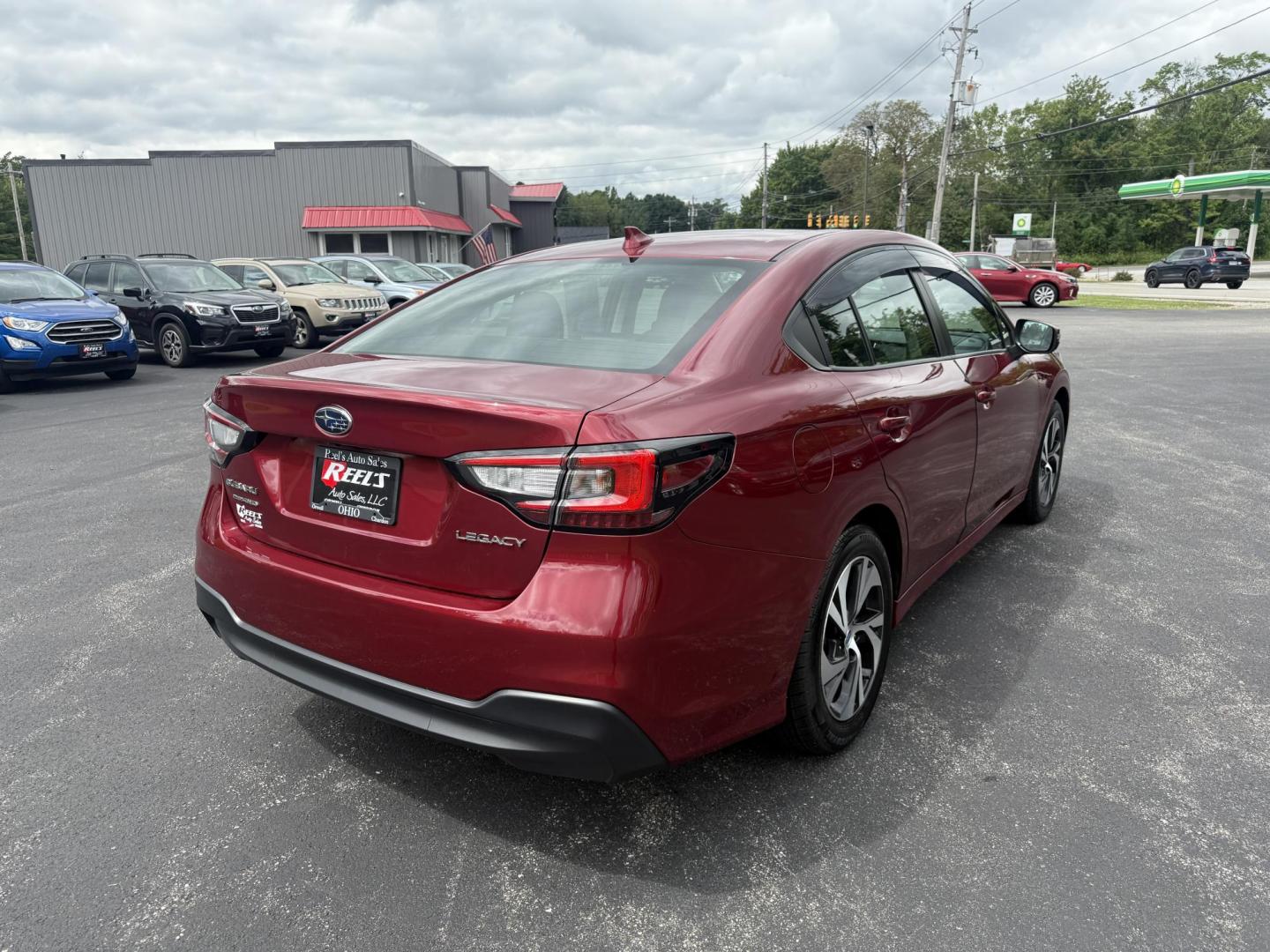 2023 Red /Black Subaru Legacy Premium (4S3BWAC6XP3) with an 2.5L H4 DOHC 16V engine, Automatic transmission, located at 11115 Chardon Rd. , Chardon, OH, 44024, (440) 214-9705, 41.580246, -81.241943 - This One Owner 2023 Subaru Legacy Premium, equipped with a 2.5L H4 engine and Symmetrical All-Wheel Drive, offers up to 35 MPG on the highway. It features full LED exterior lighting, a power driver's seat, Subaru's EyeSight Driver Assist suite (including adaptive cruise control, lane keep assist, an - Photo#7
