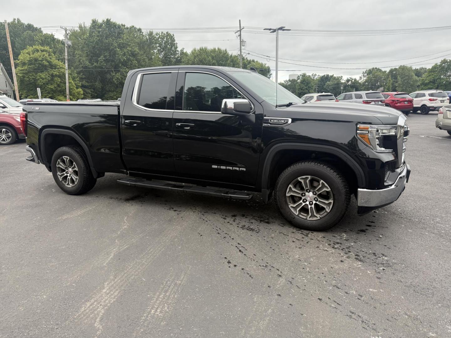 2019 Black /Black GMC Sierra 1500 SLE Double Cab 4WD (1GTR9BED1KZ) with an 5.3L V8 OHV 16V engine, 6A transmission, located at 547 E. Main St., Orwell, OH, 44076, (440) 437-5893, 41.535435, -80.847855 - This One Owner 2019 GMC Sierra 1500 SLE Double Cab, equipped with a powerful 5.3L EcoTec3 V8 engine and an 8-speed automatic transmission, features the X31 Offroad Package, G80 locking rear differential, and 3.23 gearing, giving it a robust 9,400-pound towing capacity. Comfort and technology highlig - Photo#3