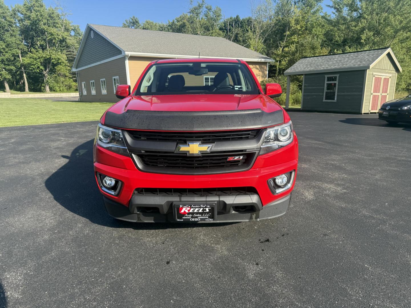 2015 Red /Black Chevrolet Colorado Z71 Crew Cab 4WD Long Box (1GCGTCE34F1) with an 3.6L V6 DOHC 24V GAS engine, 6-Speed Automatic transmission, located at 11115 Chardon Rd. , Chardon, OH, 44024, (440) 214-9705, 41.580246, -81.241943 - This 2015 Chevrolet Colorado Z71 Crew Cab 4WD, equipped with a 3.6L V6 engine and a 6-speed automatic transmission, delivers a balanced mix of power and efficiency with up to 24 MPG highway and a 7,000-pound towing capacity thanks to its 3.42 gearing and G80 locking rear differential. This midsize t - Photo#1