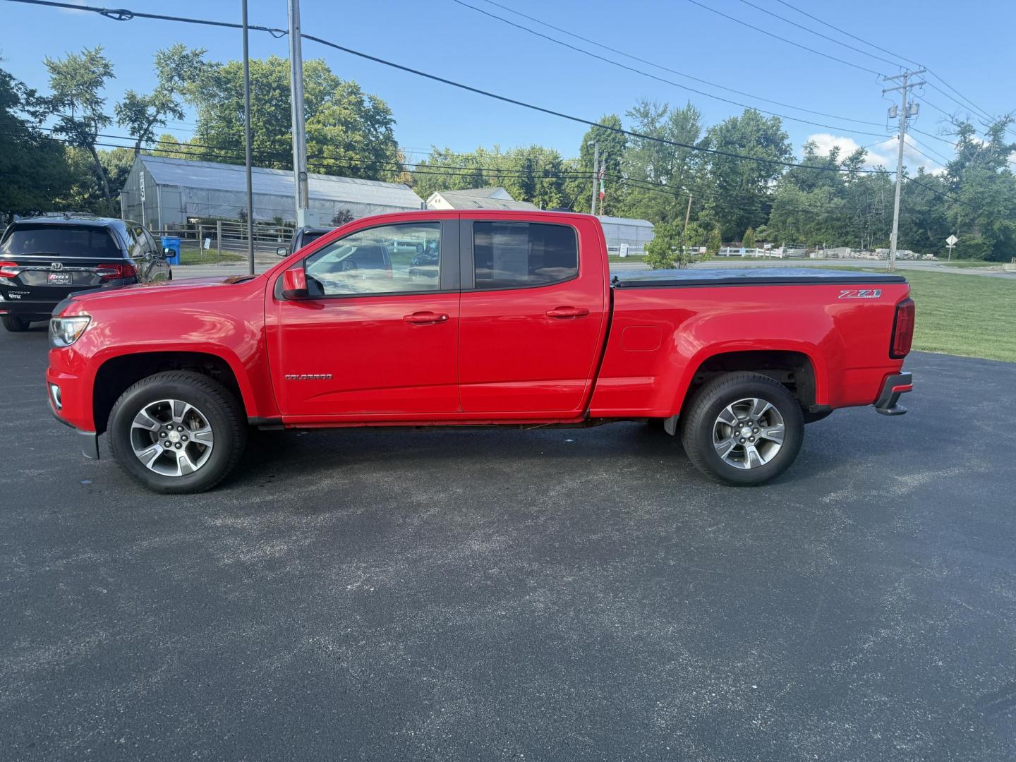 2015 Red /Black Chevrolet Colorado Z71 Crew Cab 4WD Long Box (1GCGTCE34F1) with an 3.6L V6 DOHC 24V GAS engine, 6-Speed Automatic transmission, located at 11115 Chardon Rd. , Chardon, OH, 44024, (440) 214-9705, 41.580246, -81.241943 - This 2015 Chevrolet Colorado Z71 Crew Cab 4WD, equipped with a 3.6L V6 engine and a 6-speed automatic transmission, delivers a balanced mix of power and efficiency with up to 24 MPG highway and a 7,000-pound towing capacity thanks to its 3.42 gearing and G80 locking rear differential. This midsize t - Photo#13