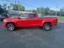 2015 Red /Black Chevrolet Colorado Z71 Crew Cab 4WD Long Box (1GCGTCE34F1) with an 3.6L V6 DOHC 24V GAS engine, 6-Speed Automatic transmission, located at 11115 Chardon Rd. , Chardon, OH, 44024, (440) 214-9705, 41.580246, -81.241943 - This 2015 Chevrolet Colorado Z71 Crew Cab 4WD, equipped with a 3.6L V6 engine and a 6-speed automatic transmission, delivers a balanced mix of power and efficiency with up to 24 MPG highway and a 7,000-pound towing capacity thanks to its 3.42 gearing and G80 locking rear differential. This midsize t - Photo#13