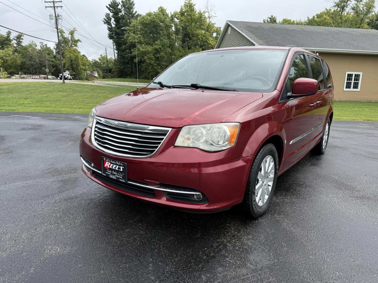 2015 Red /Tan Chrysler Town & Country Touring (2C4RC1BG5FR) with an 3.6L V6 DOHC 24V engine, 6-Speed Automatic transmission, located at 547 E. Main St., Orwell, OH, 44076, (440) 437-5893, 41.535435, -80.847855 - This 2015 Chrysler Town & Country Touring came from Maryland and it shows underneath, equipped with a 3.6L Pentastar V6 engine and 6-speed automatic transmission, offers a luxurious and versatile minivan experience with features like leather interior, tri-zone automatic climate control, power driver - Photo#0